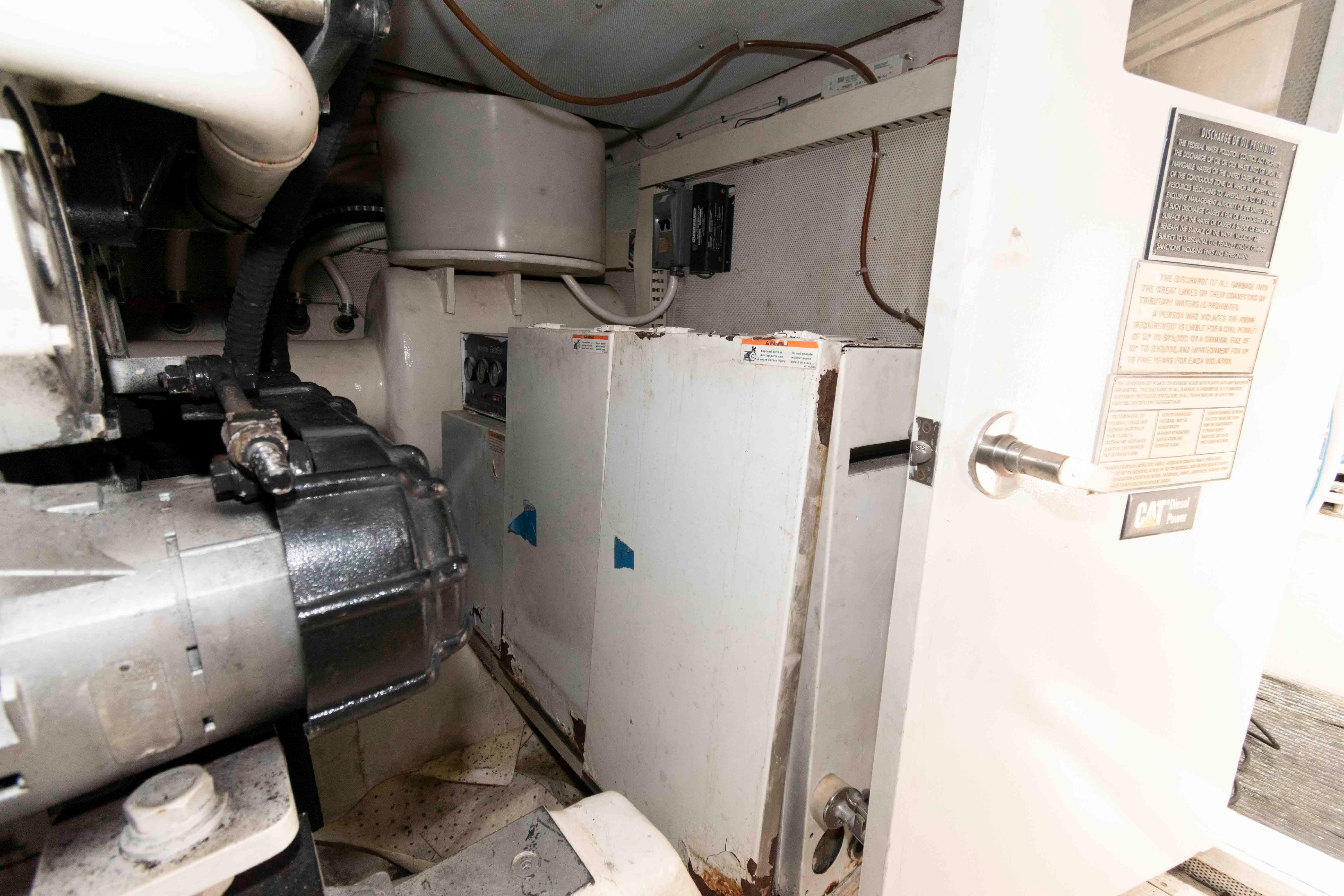 Engine room of 2003 Neptunus 56 Flybridge yacht, featuring mechanical components and equipment.