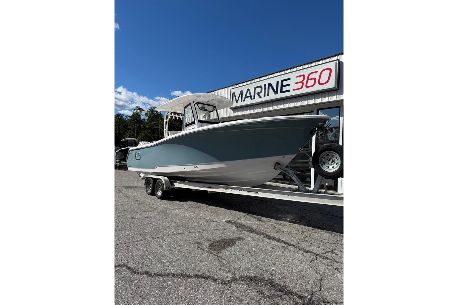 2026 Sea Hunt Ultra 285 Coffin Box boat on trailer at Marine 360 dealership.