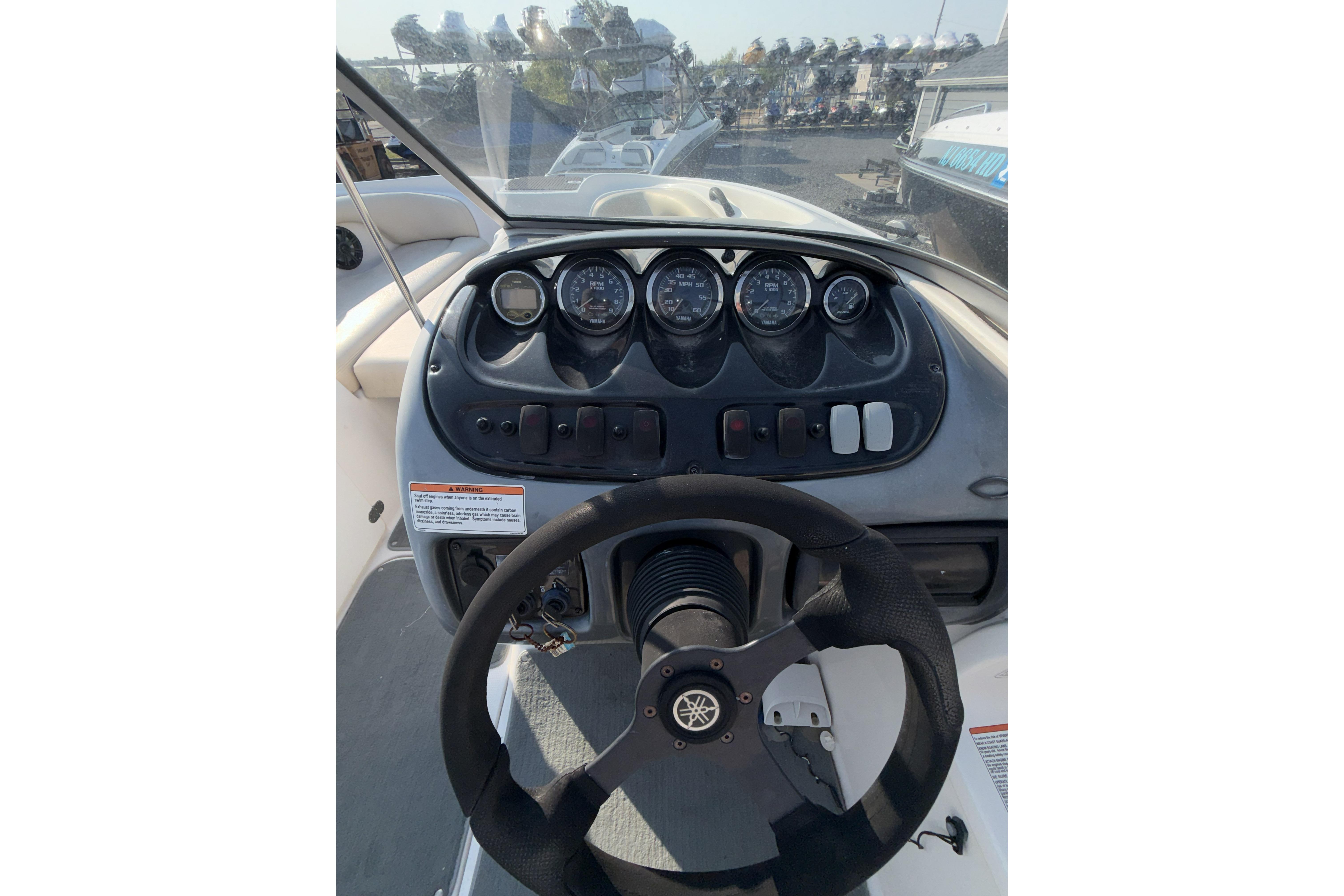 2006 Yamaha Boats SX210 dashboard with steering wheel and instrument panel.