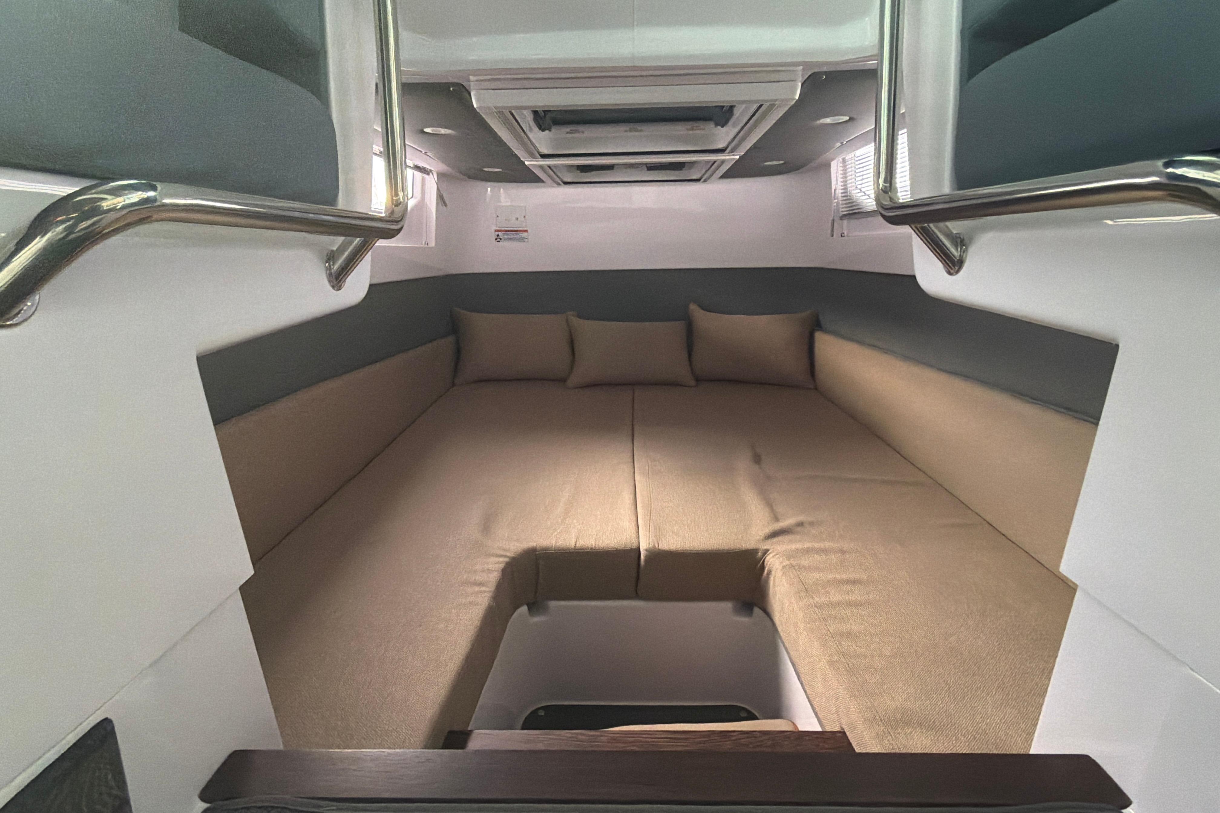 Luxurious interior cabin of 2022 Axopar Brabus 37 XC Cross Cabin with plush seating.