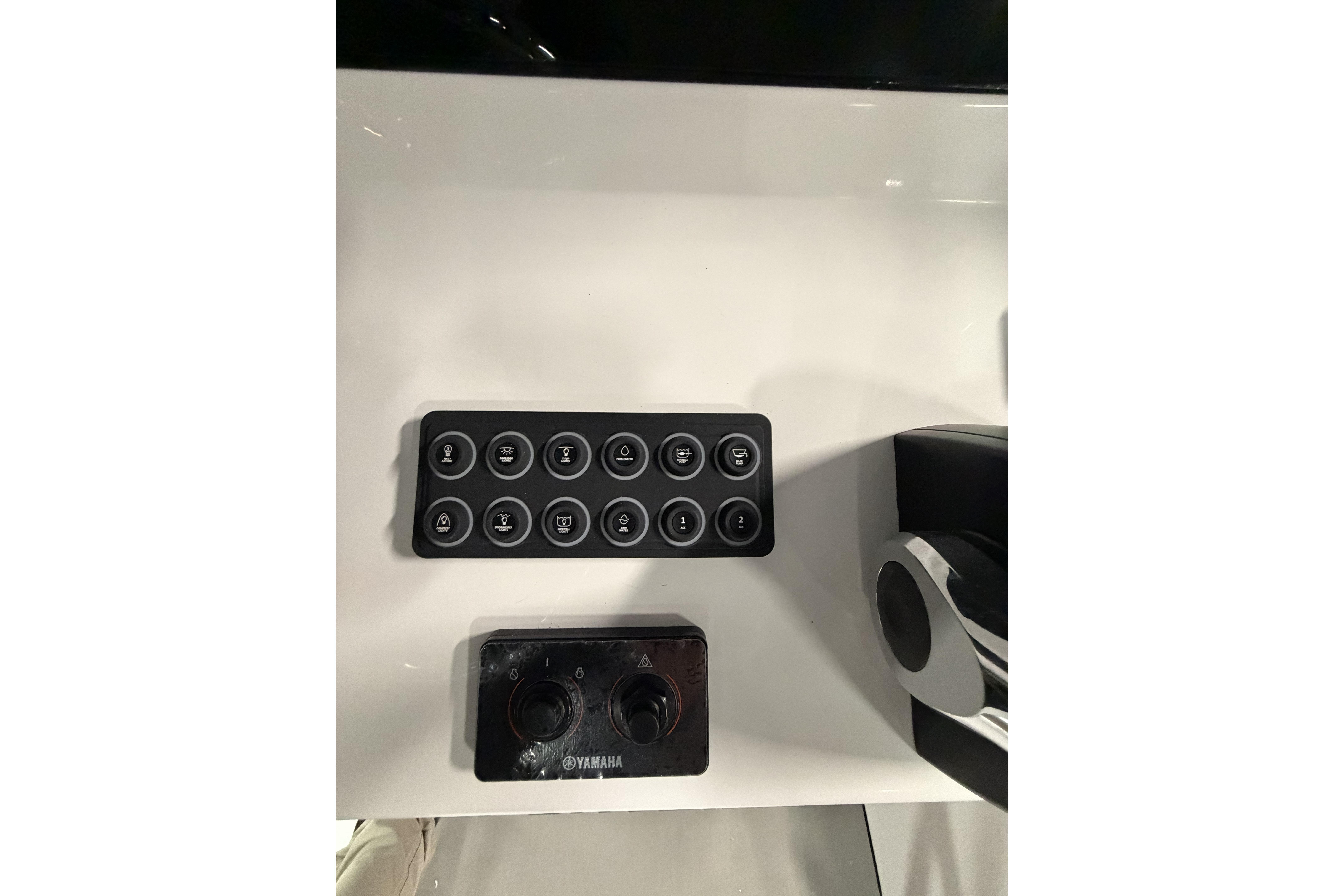 Control panel of 2026 Sportsman Open 232 Center Console boat with Yamaha controls.