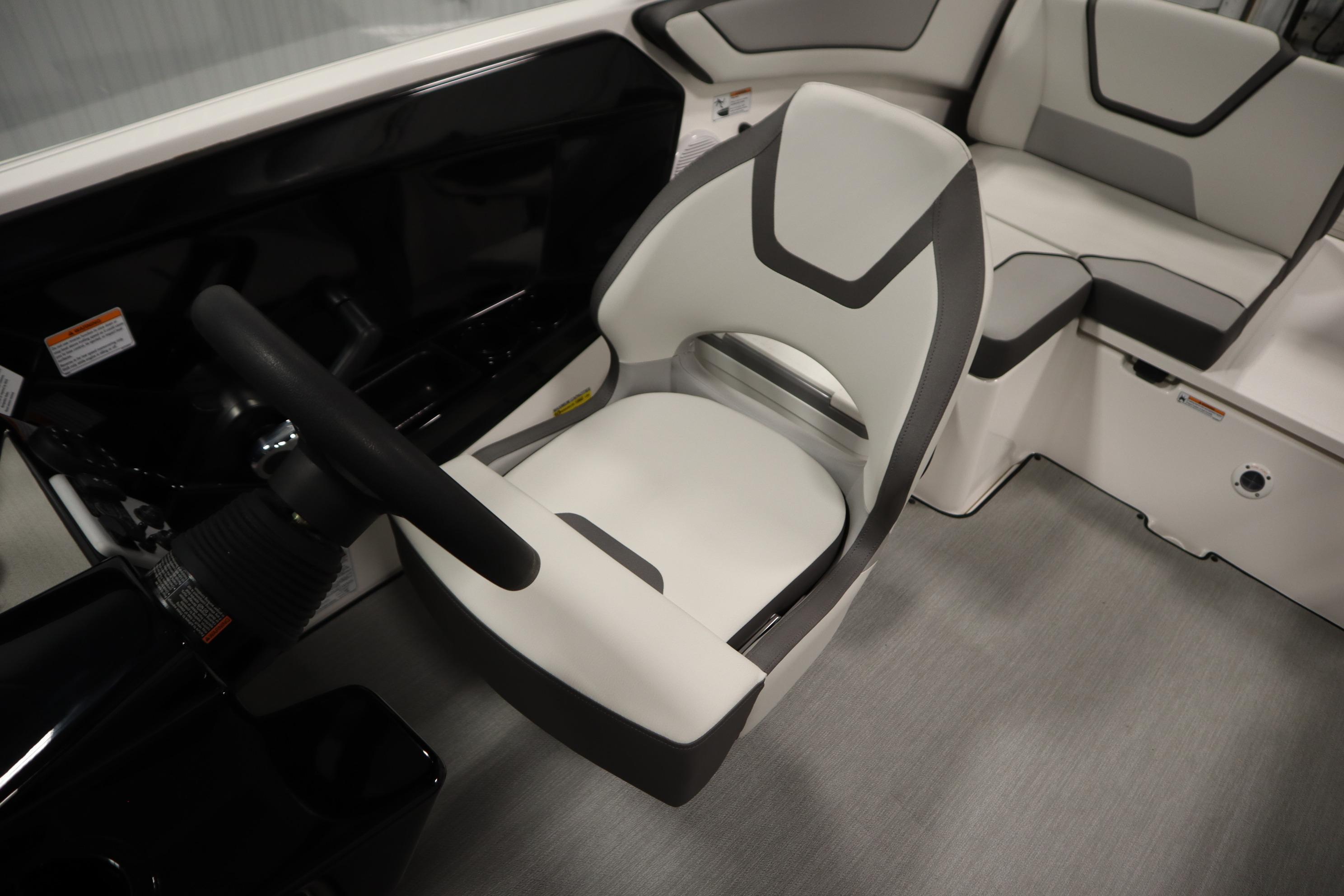 2026 Yamaha Boats AR220 interior with modern seating and steering wheel.