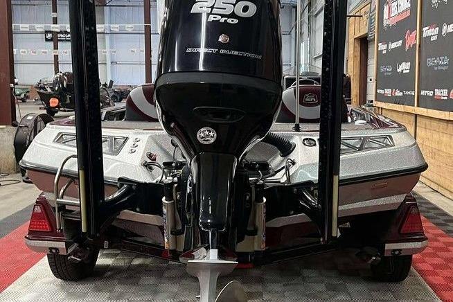 2018 Ranger Z520L boat with 250 Pro outboard motor in a garage setting.