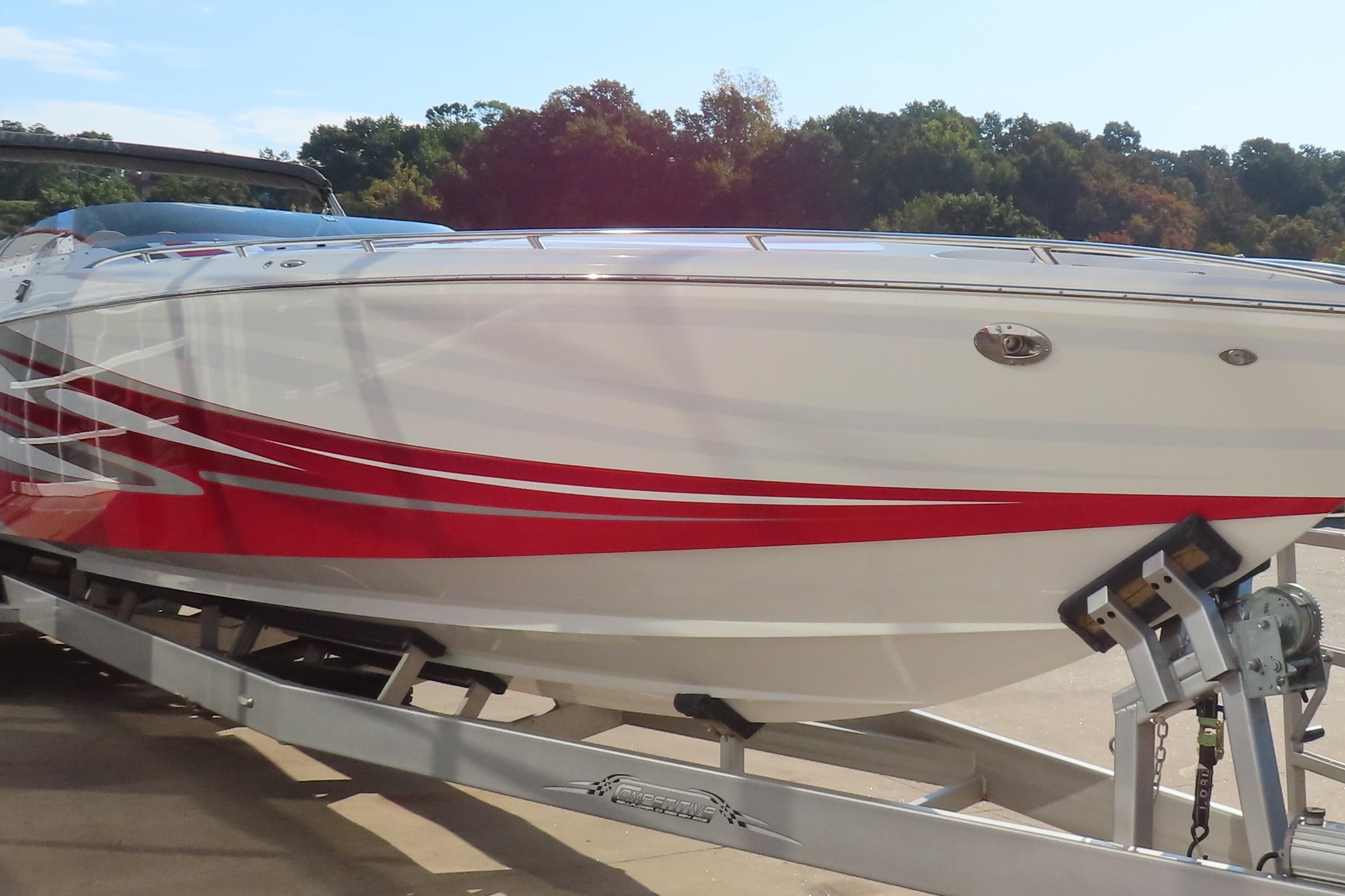2013 Nordic 39 Poker Run boat with red stripes on a trailer.