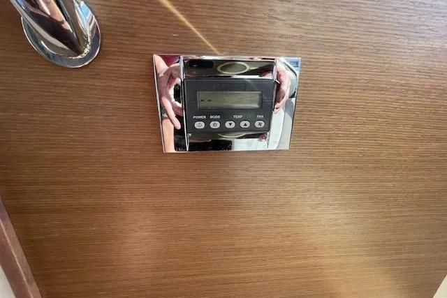 Control panel on 2016 Sea Ray Sundancer 510 yacht, mounted on wooden interior.