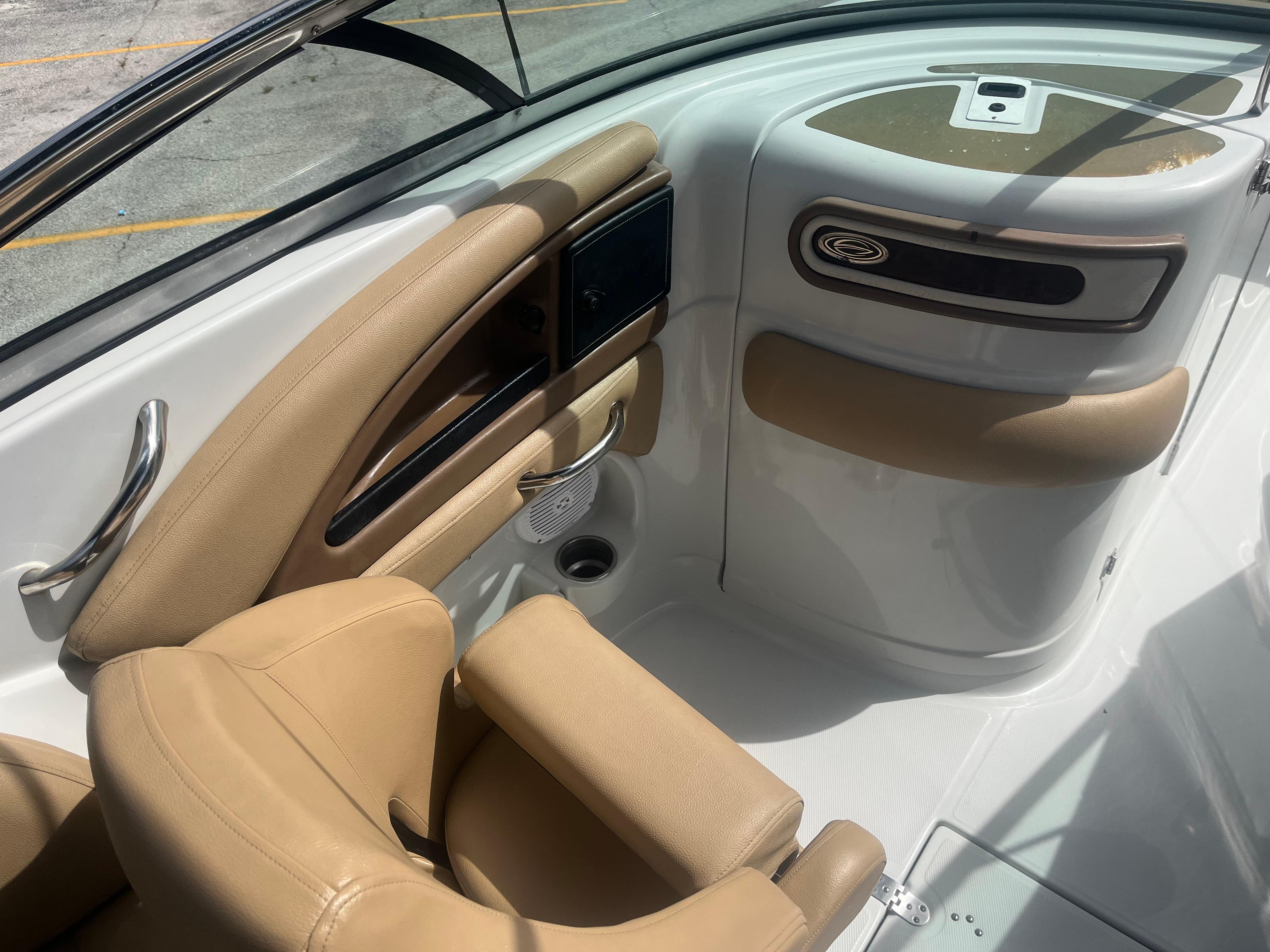 2022 Crownline Eclipse E235 XS boat interior with tan seating and sleek design.