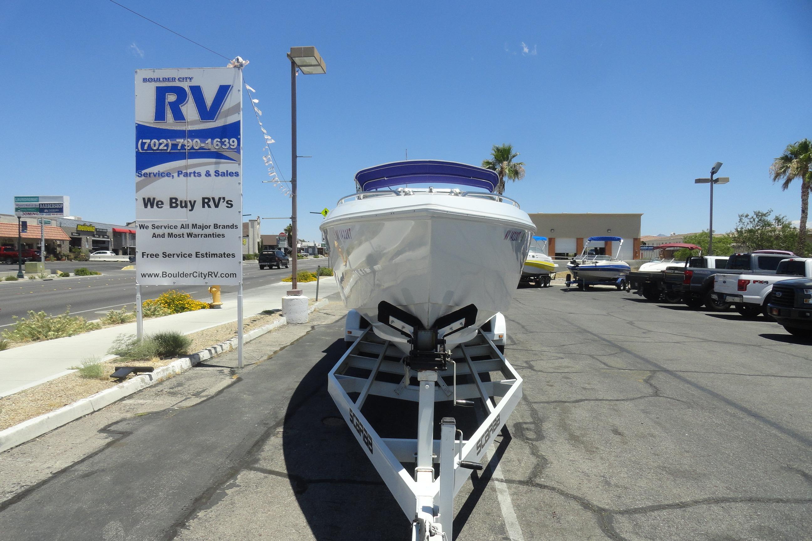 1988 Wellcraft 34 Scarab boat on trailer at Boulder City RV dealership.