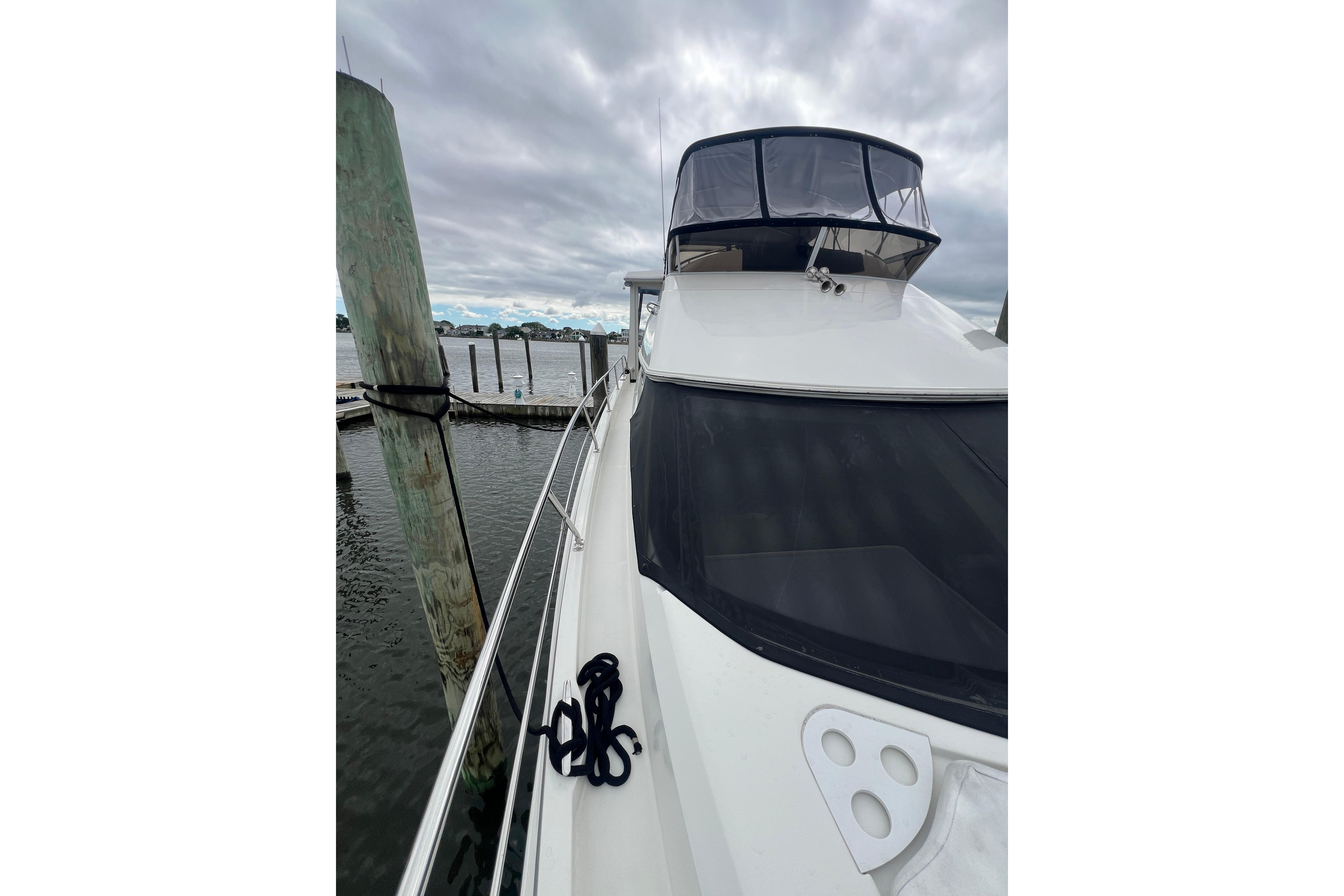 2006 Carver 43 Motor Yacht docked, featuring sleek design and spacious deck.