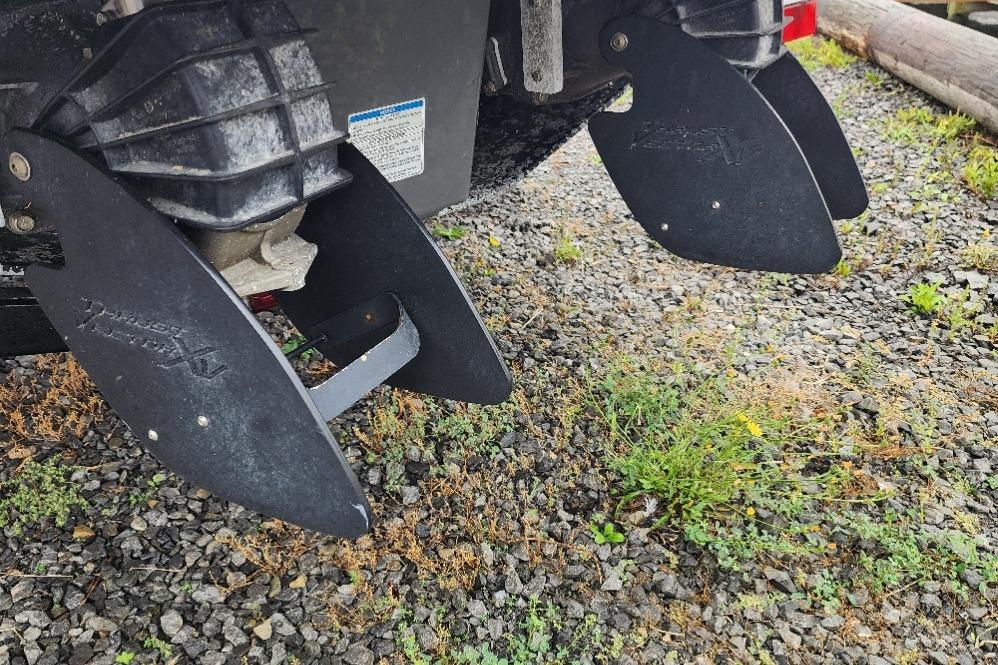 Yamaha Boats 212X 2015 jet nozzles on gravel surface.