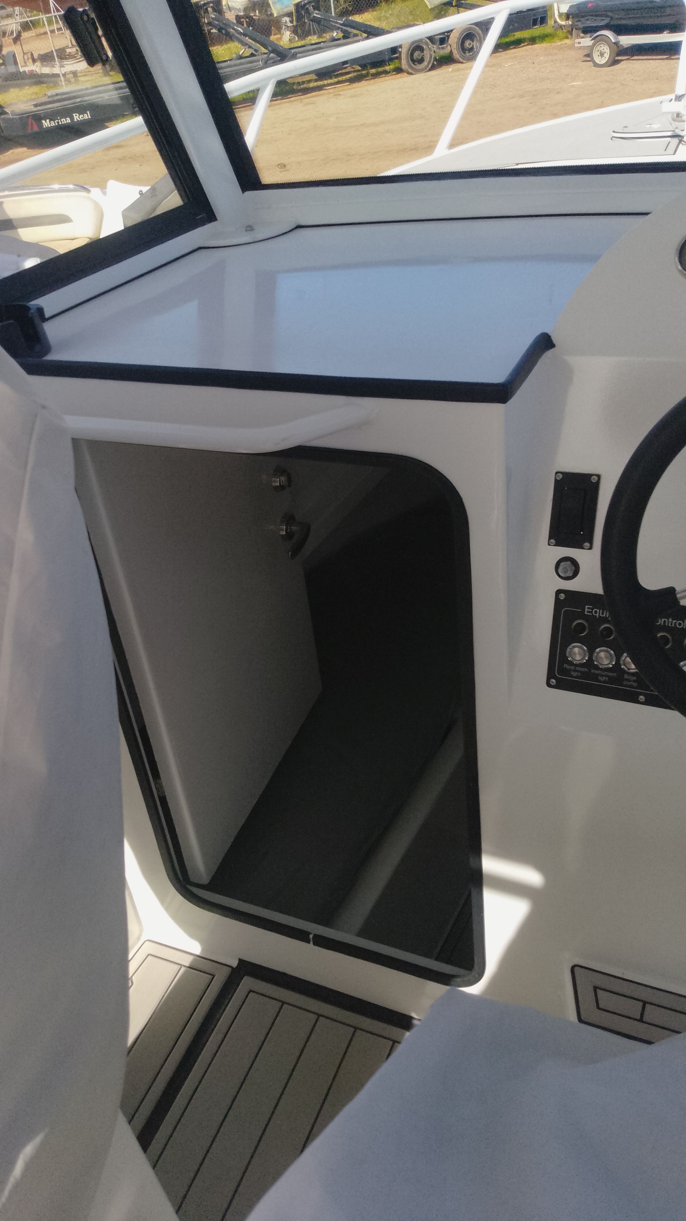 Interior of Gospel Boat 7.5M, 2024 model, featuring steering console.