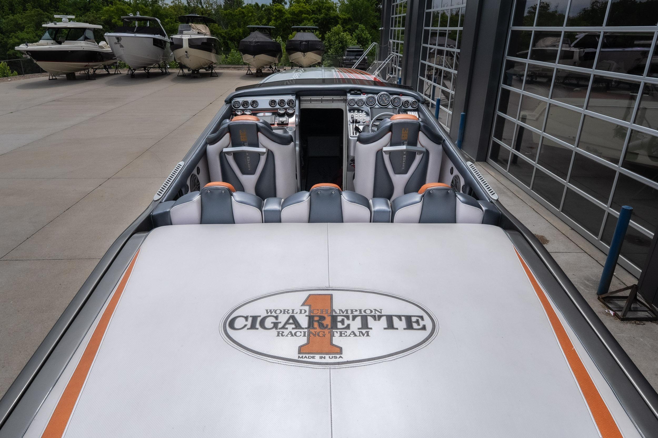 2006 Cigarette 39' Top Gun Unlimited boat interior with branded seating and dashboard.