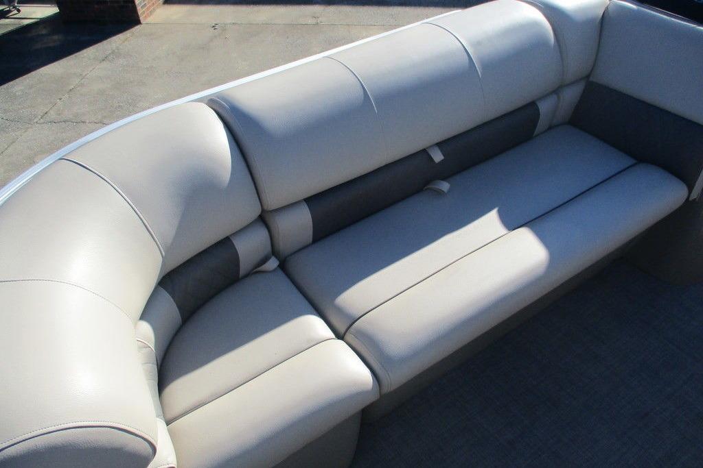 2022 Sun Tracker Party Barge 20 DLX, featuring comfortable beige seating.