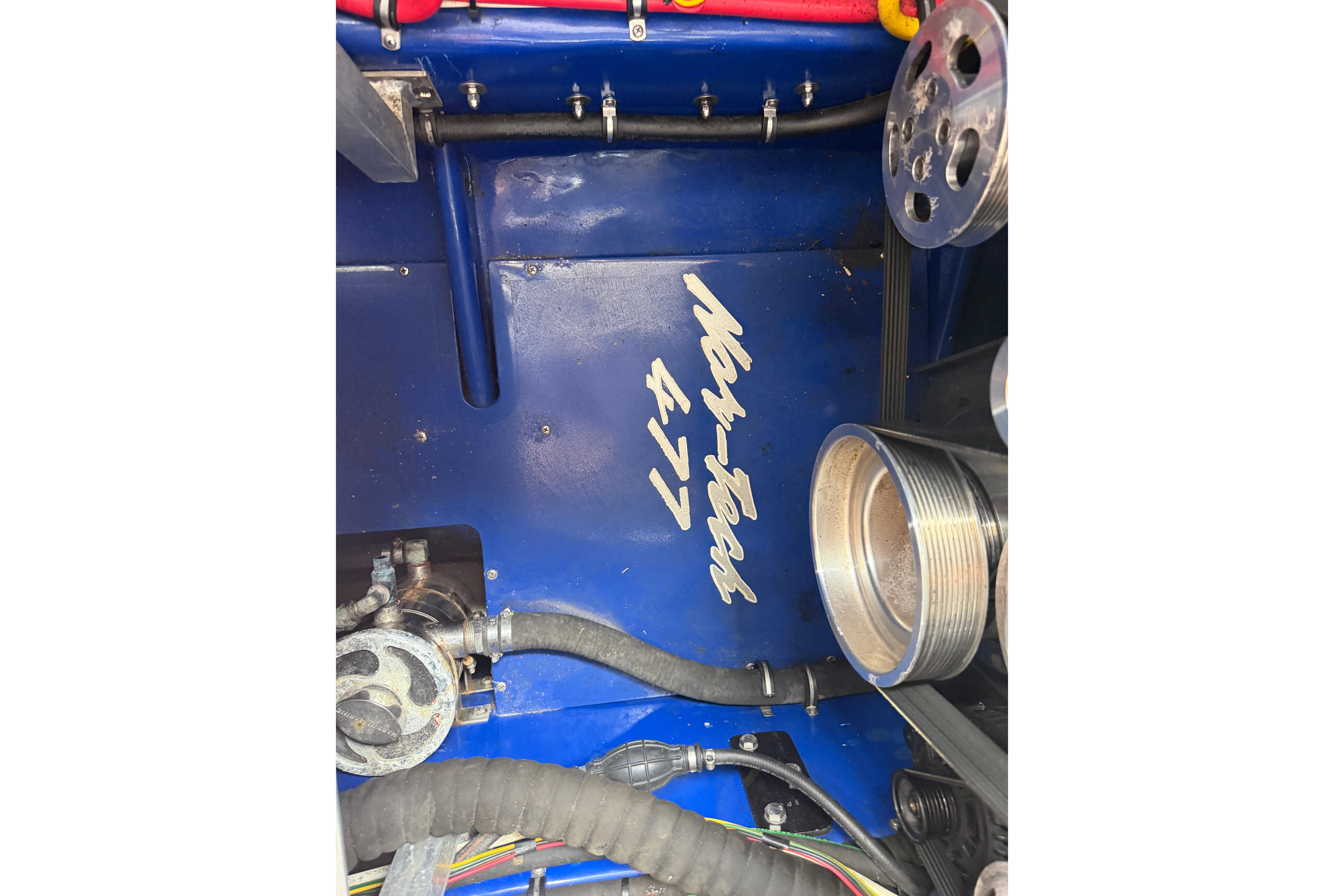 Engine compartment of 2013 Nor-Tech 477 SPX Vee Bottom boat, showcasing mechanical components.