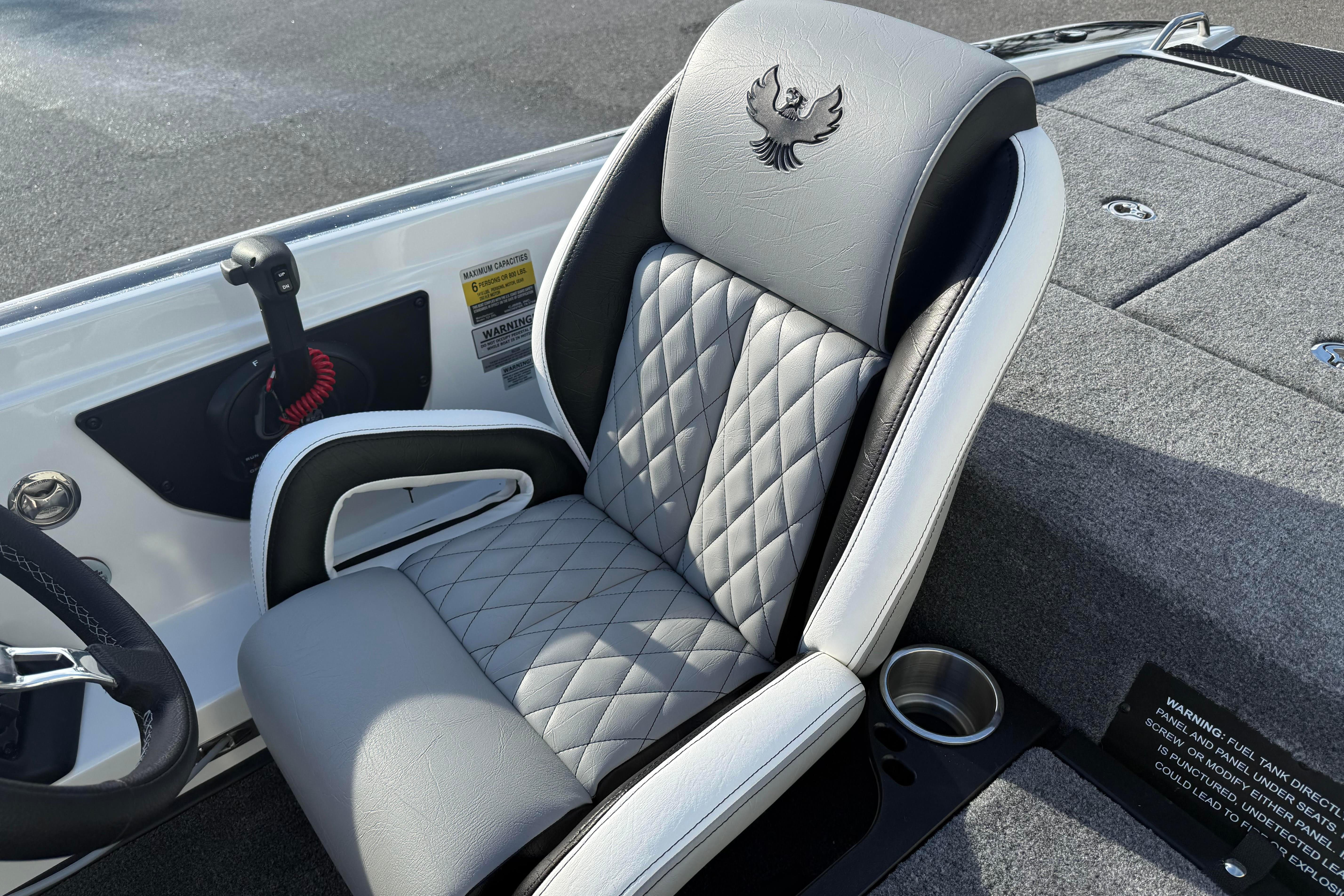 Luxurious seating in 2027 Phoenix 721 ZXL boat with quilted design and cup holder.