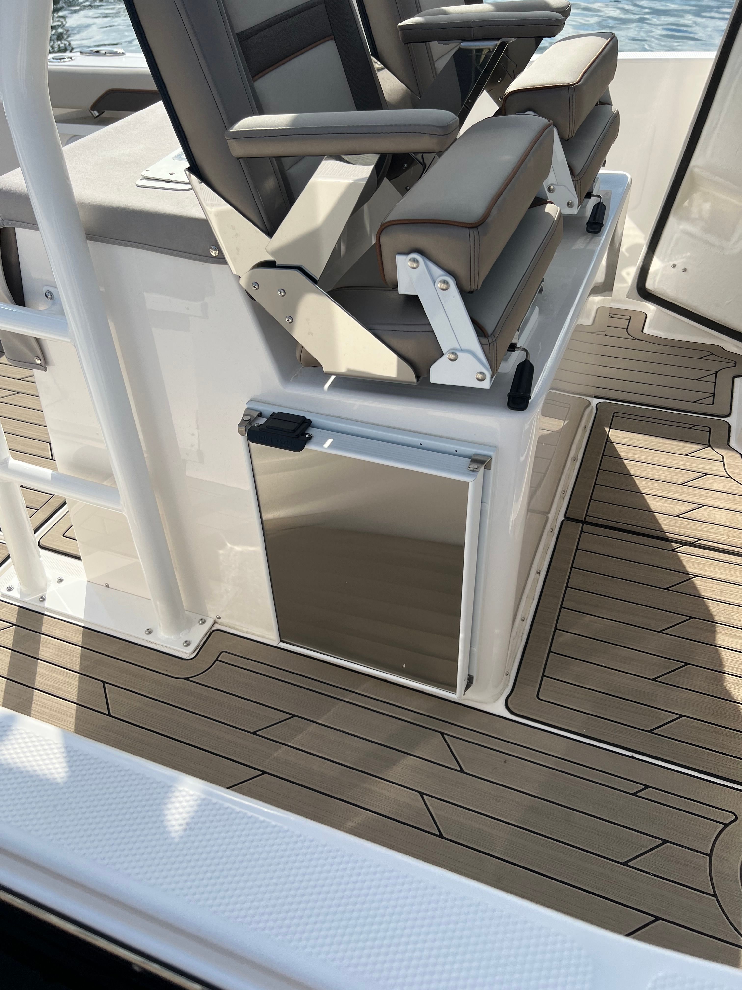 The image shows the interior of a 2022 Cutwater C-24 CW boat with cushioned seats.