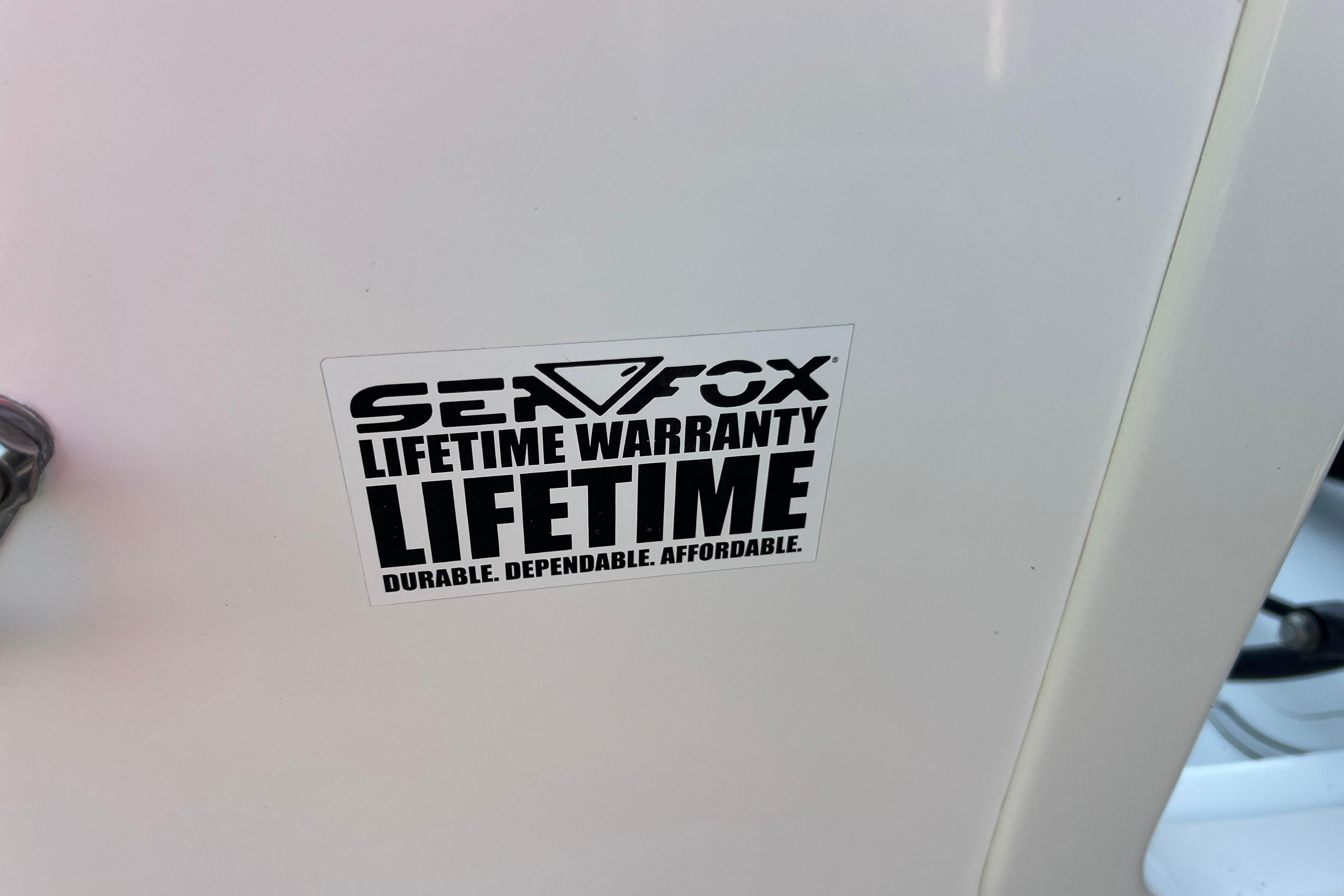 Sticker on 2012 Sea Fox 206 Center Console, promoting lifetime warranty.