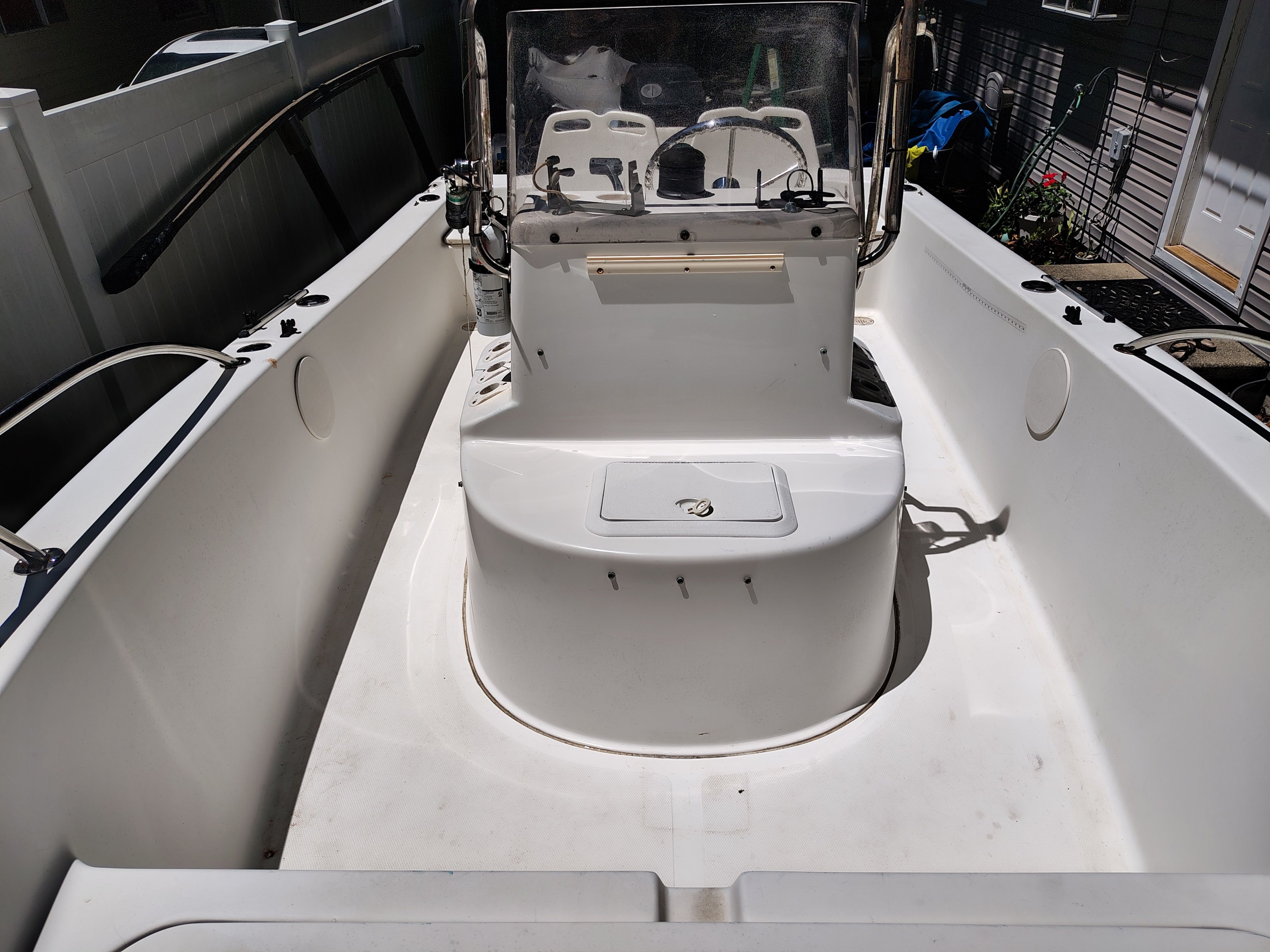 2003 Sea Pro 180 Center Console boat with helm and seating area.