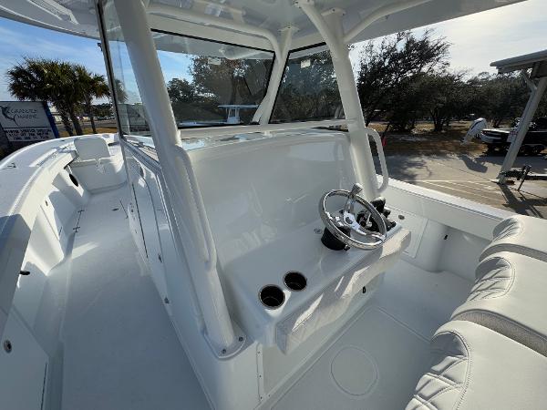 2025 Yellowfin 39 Offshore boat interior with steering wheel and seating.