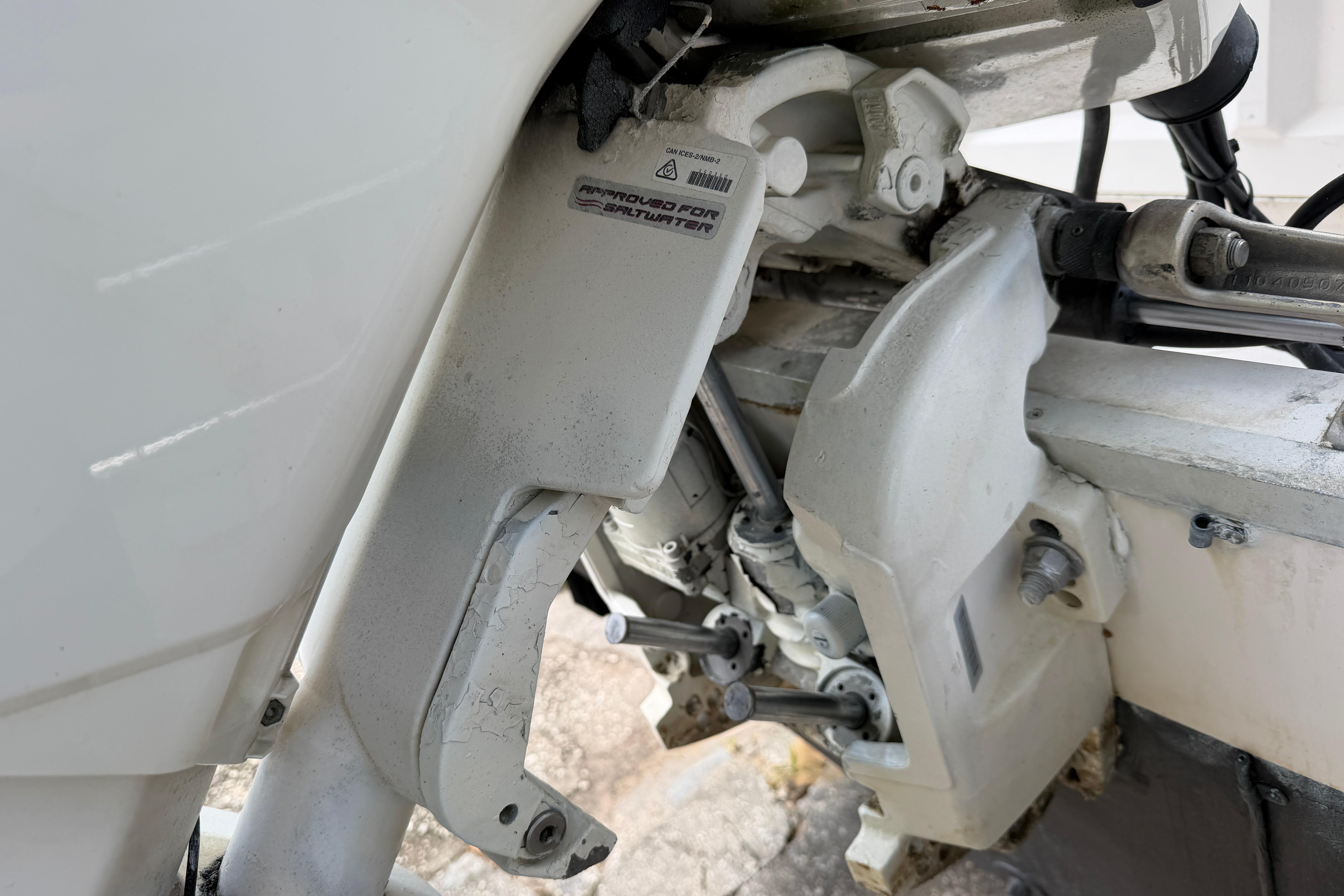 Close-up of a 1987 Grady-White Seafarer 226 boat engine components.