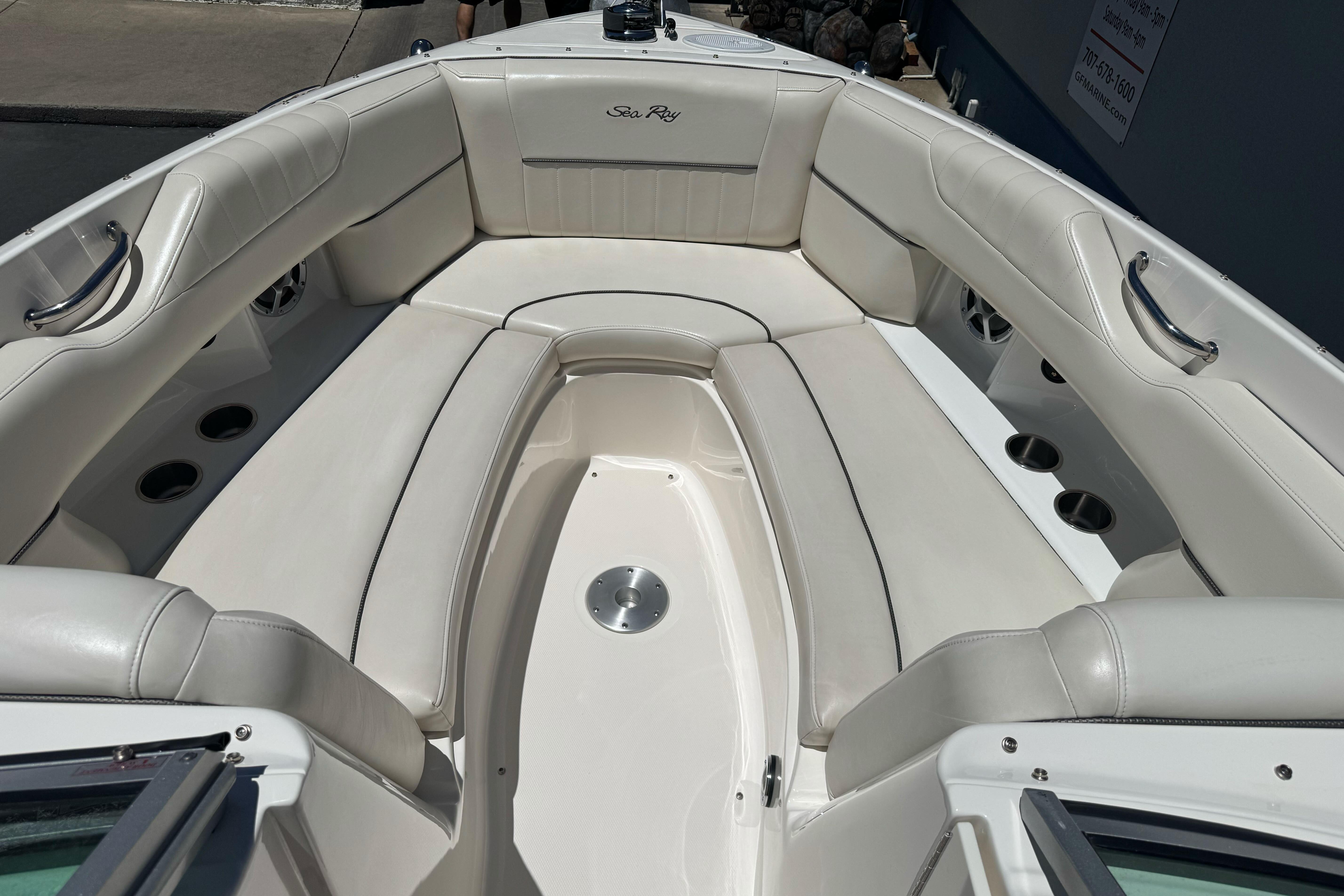 Luxurious seating area on a 2007 Sea Ray SLX 250 boat, featuring white upholstery.