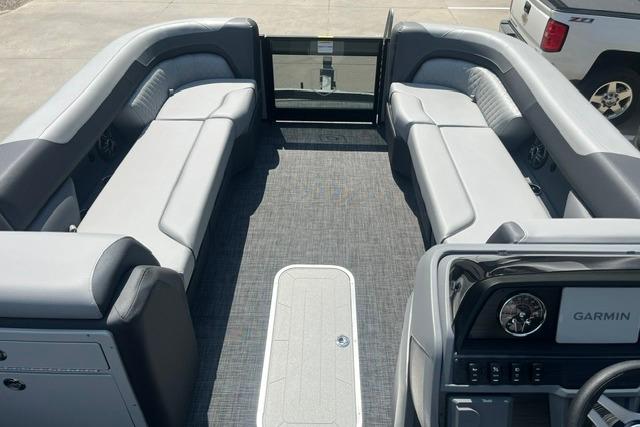 2026 Godfrey Sweetwater 2286 SBC pontoon boat interior with gray seating and Garmin dashboard.