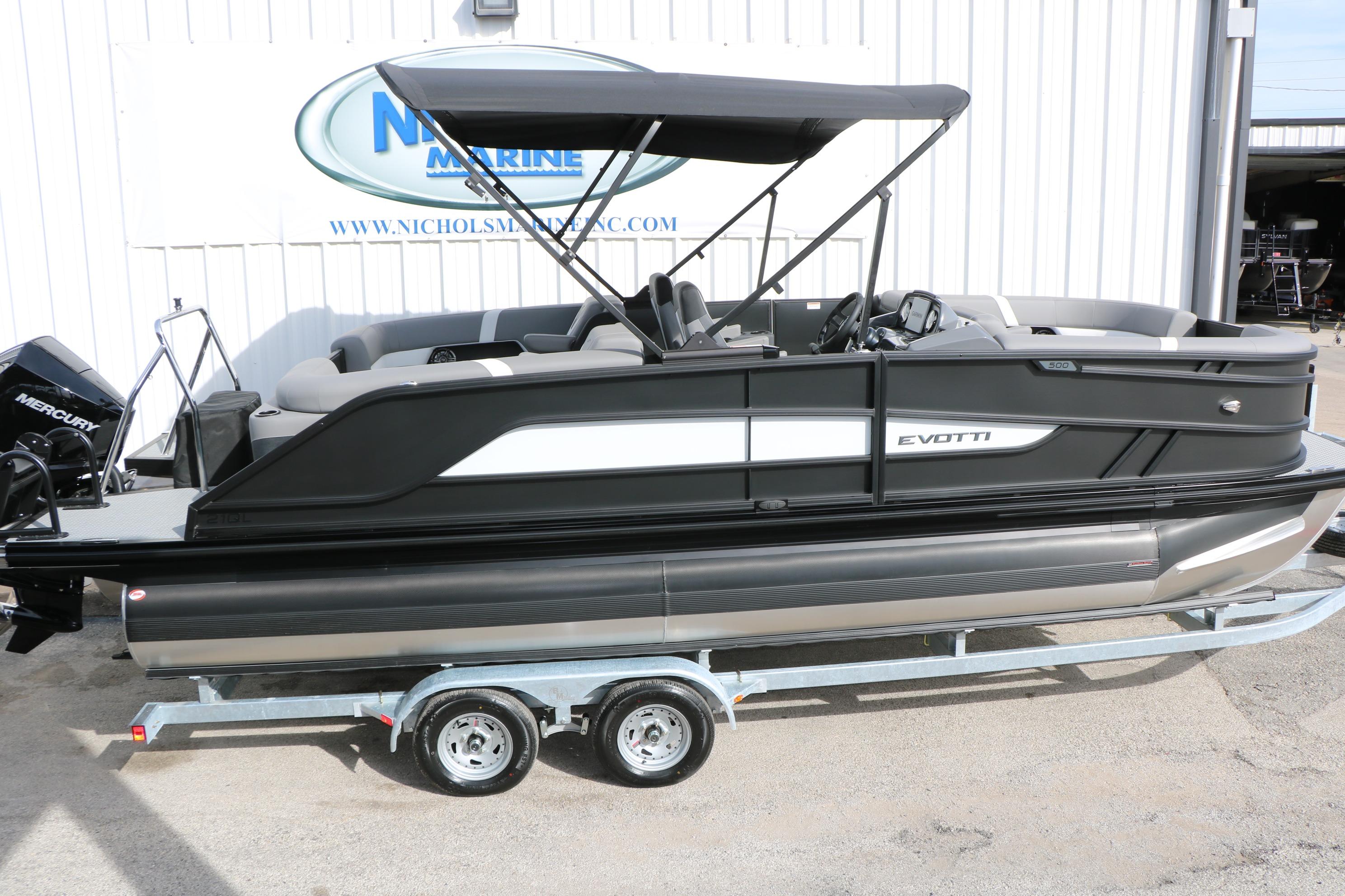 2026 Evotti 521QL pontoon boat on trailer, featuring sleek design and Mercury engine.