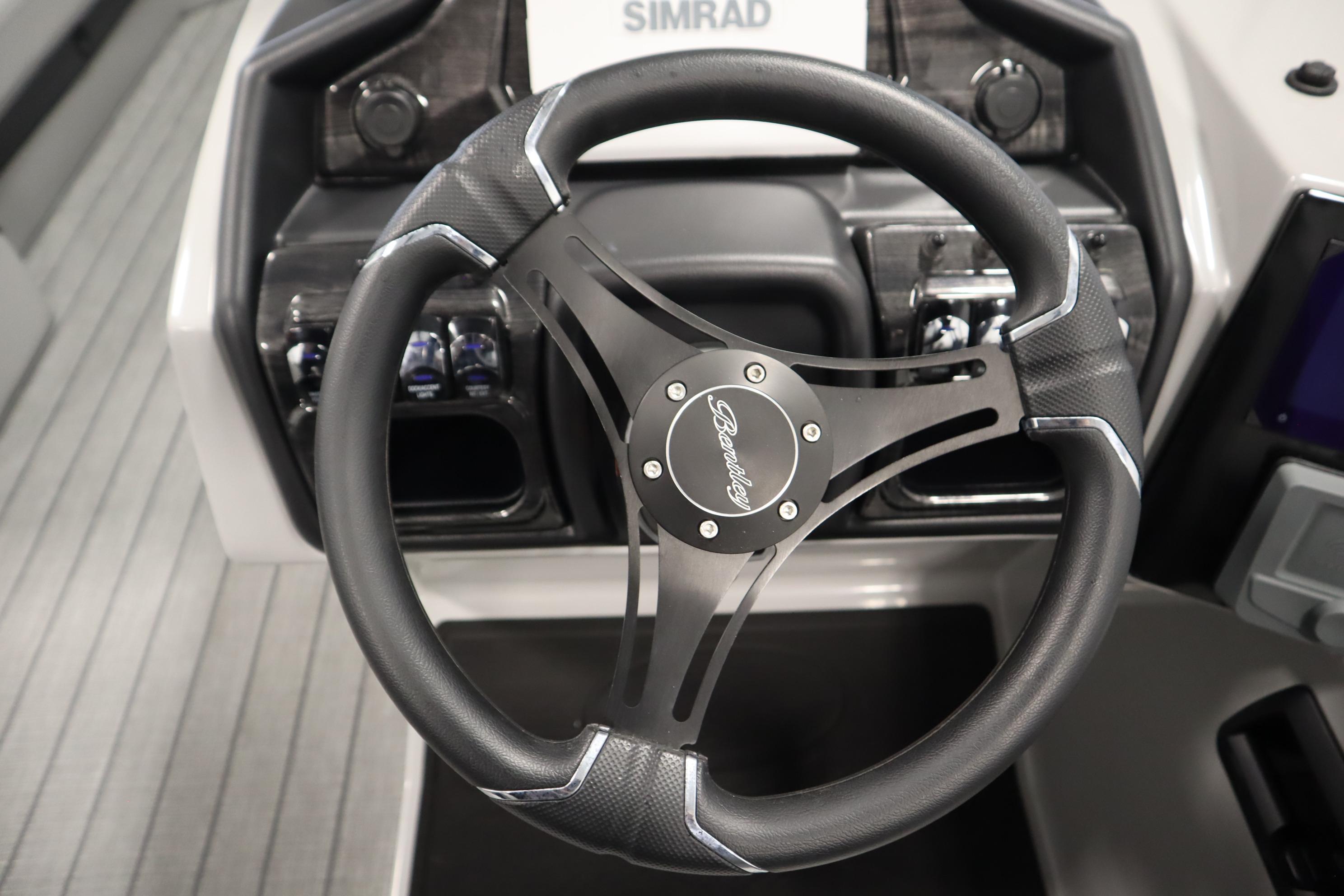 2025 Bentley Pontoons Elite 253 Admiral Tri-toon steering wheel and dashboard detail.