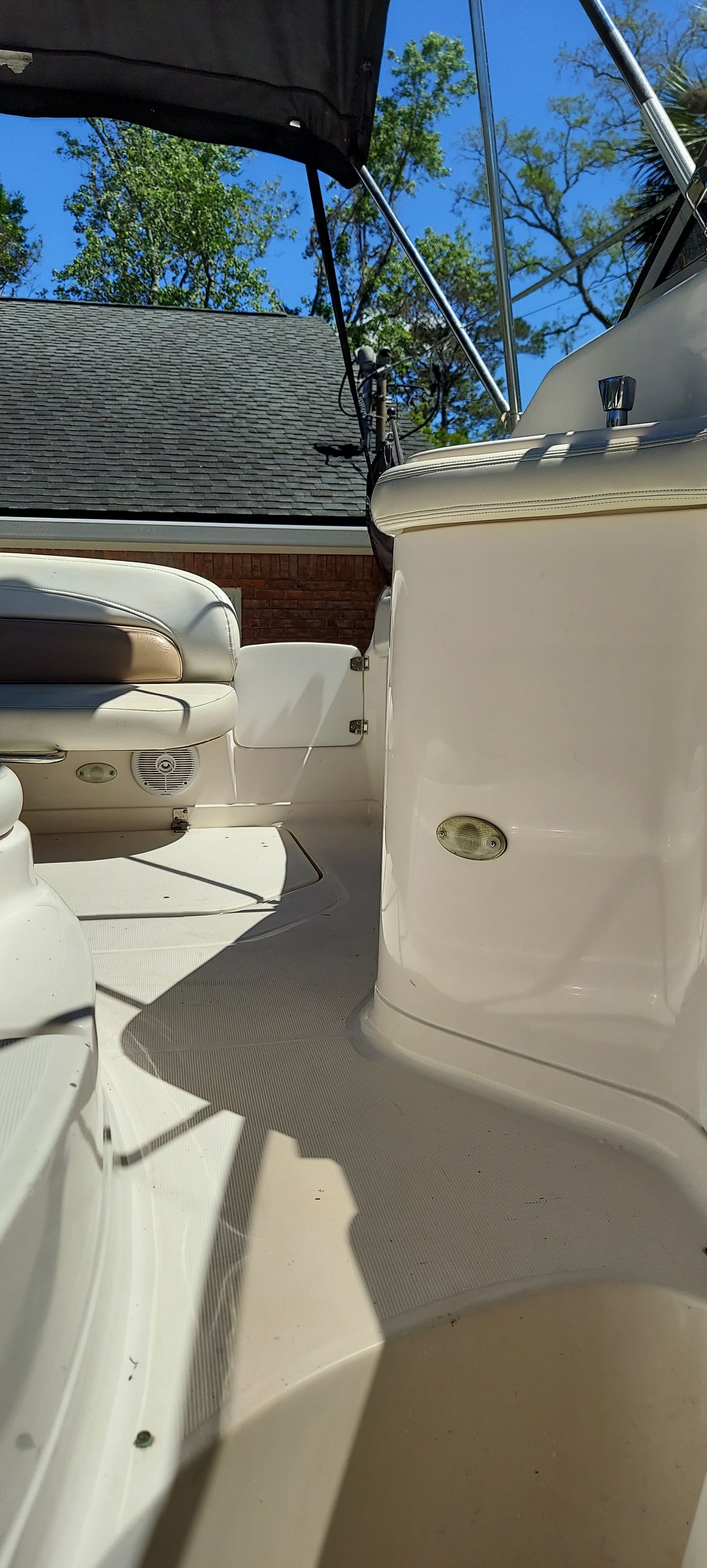 Interior of a 2004 Regal Commodore 2465 boat in sunny weather.