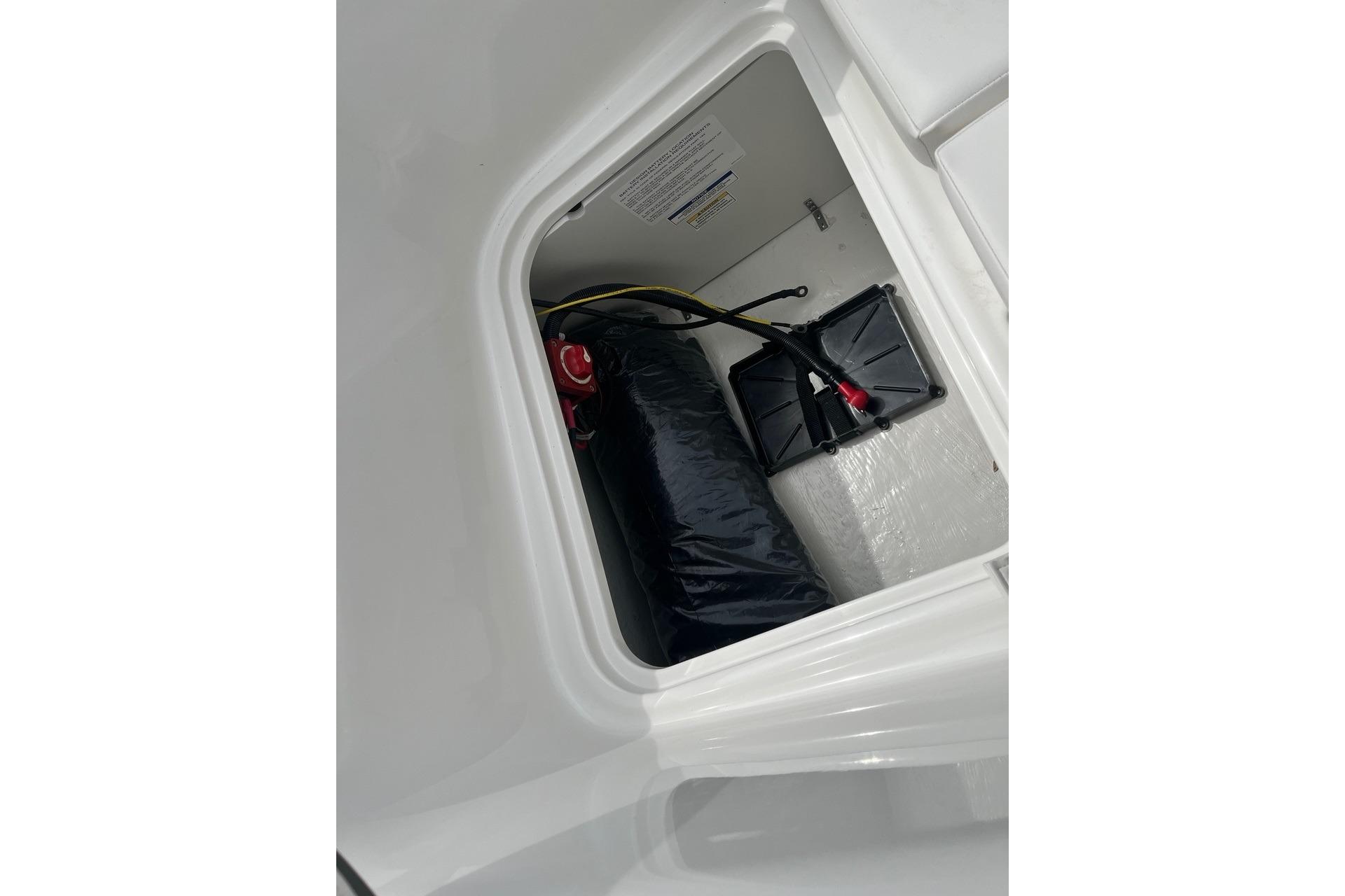 View inside storage compartment of 2026 Bayliner Element E16 boat.