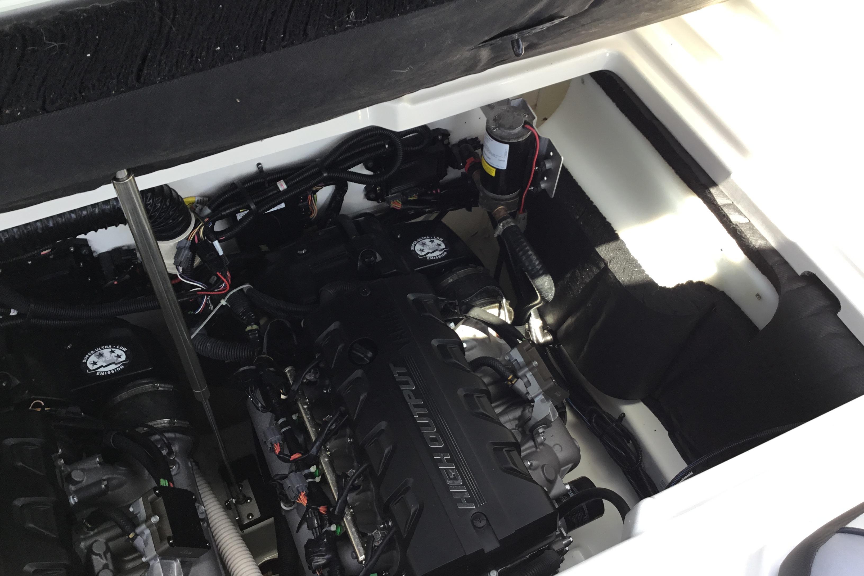 Engine compartment of 2023 Yamaha Boats 252XE, showcasing high-output engine components.
