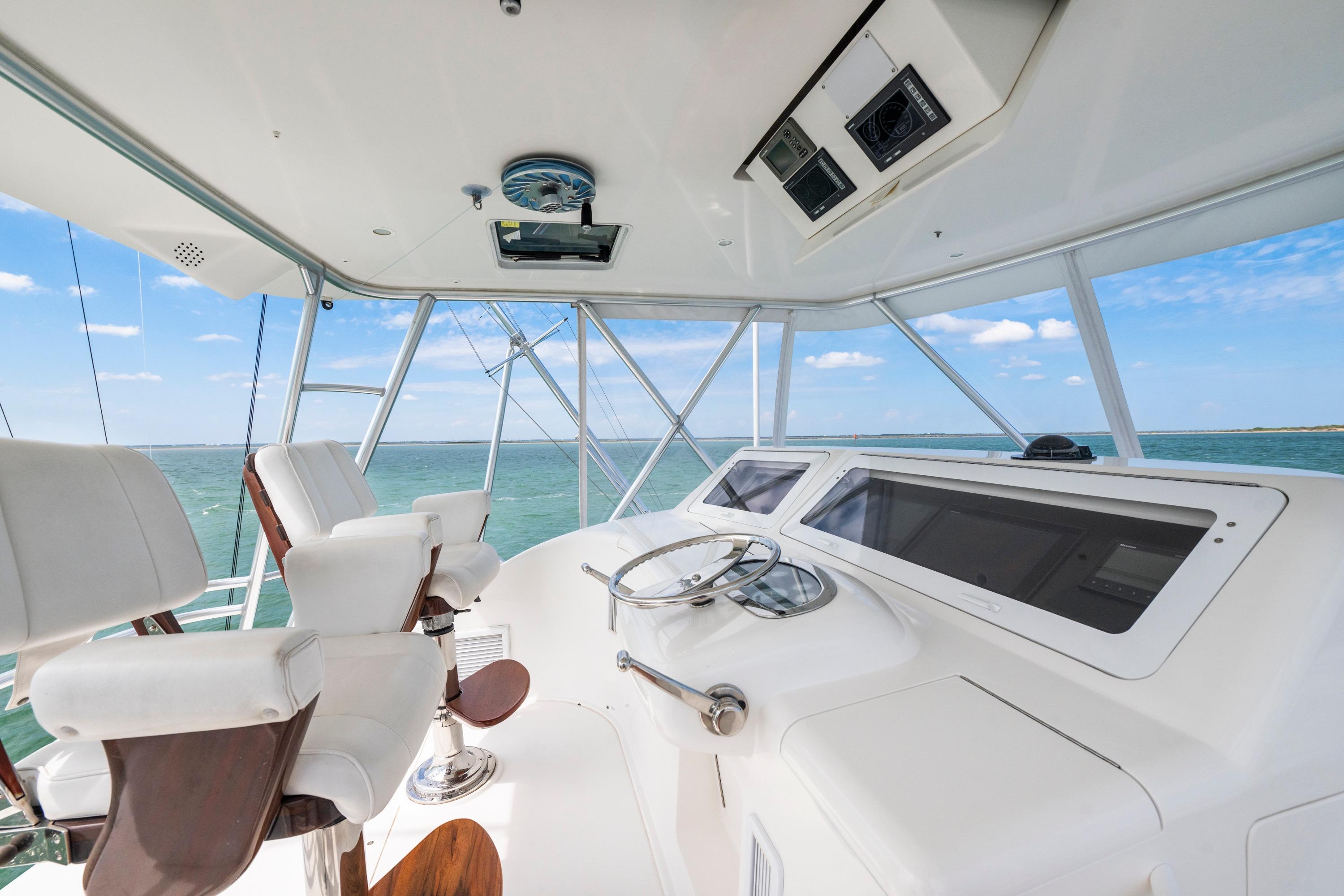 2009 Viking 50 Convertible yacht helm with ocean view and modern controls.