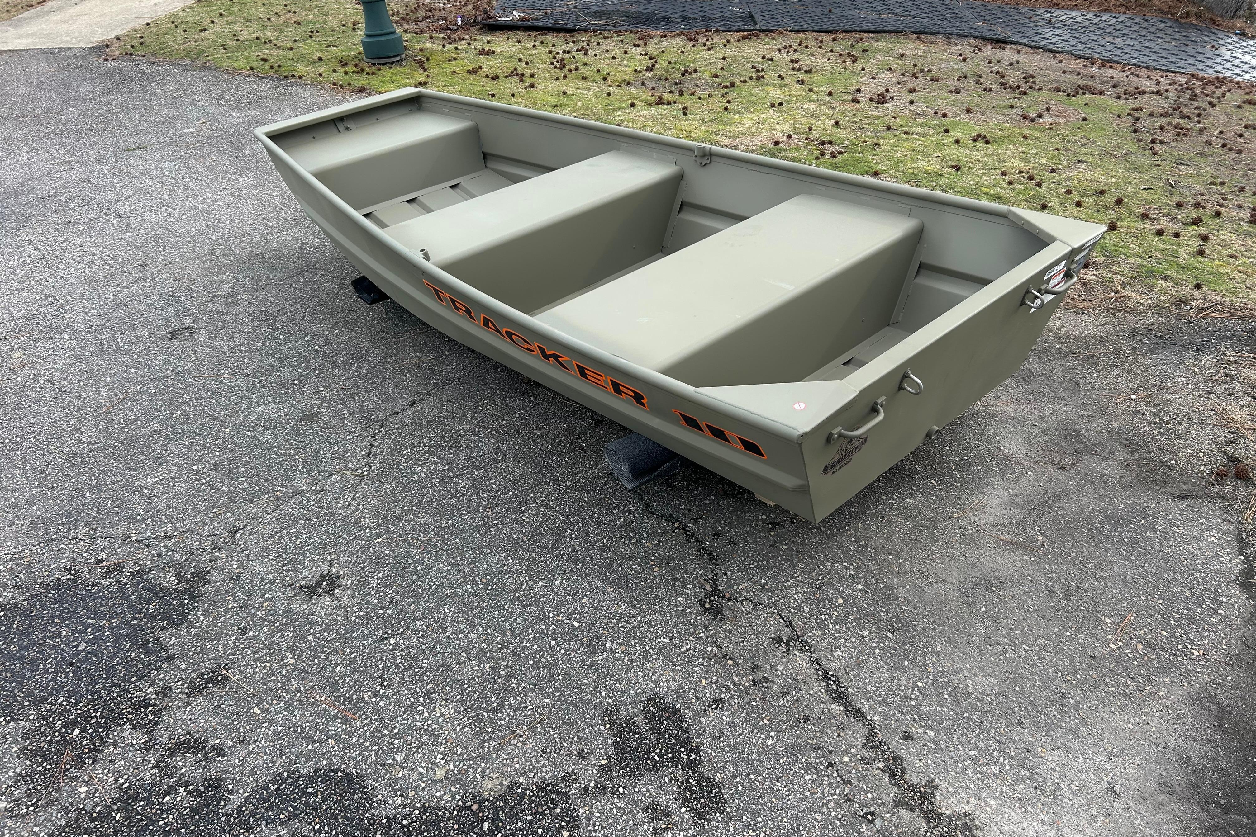 2026 Tracker Grizzly 10 Jon boat on pavement, showcasing its sturdy design.