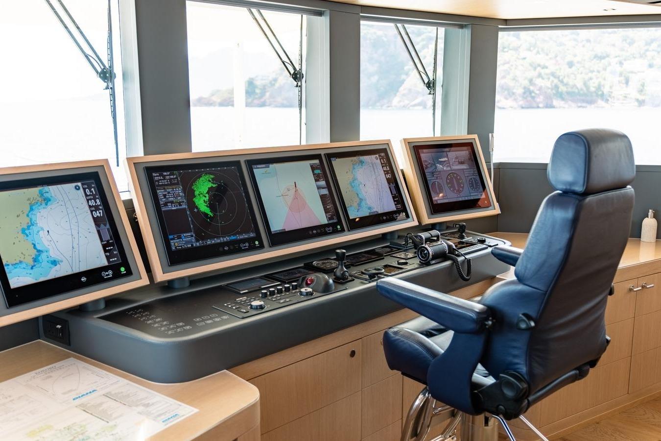 Bridge of 2020 Moonen Martinique YN1 yacht with navigation screens and captain's chair.