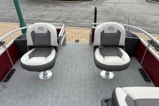 2026 Sun Tracker Bass Buggy 18 DLX pontoon boat with dual swivel seats.