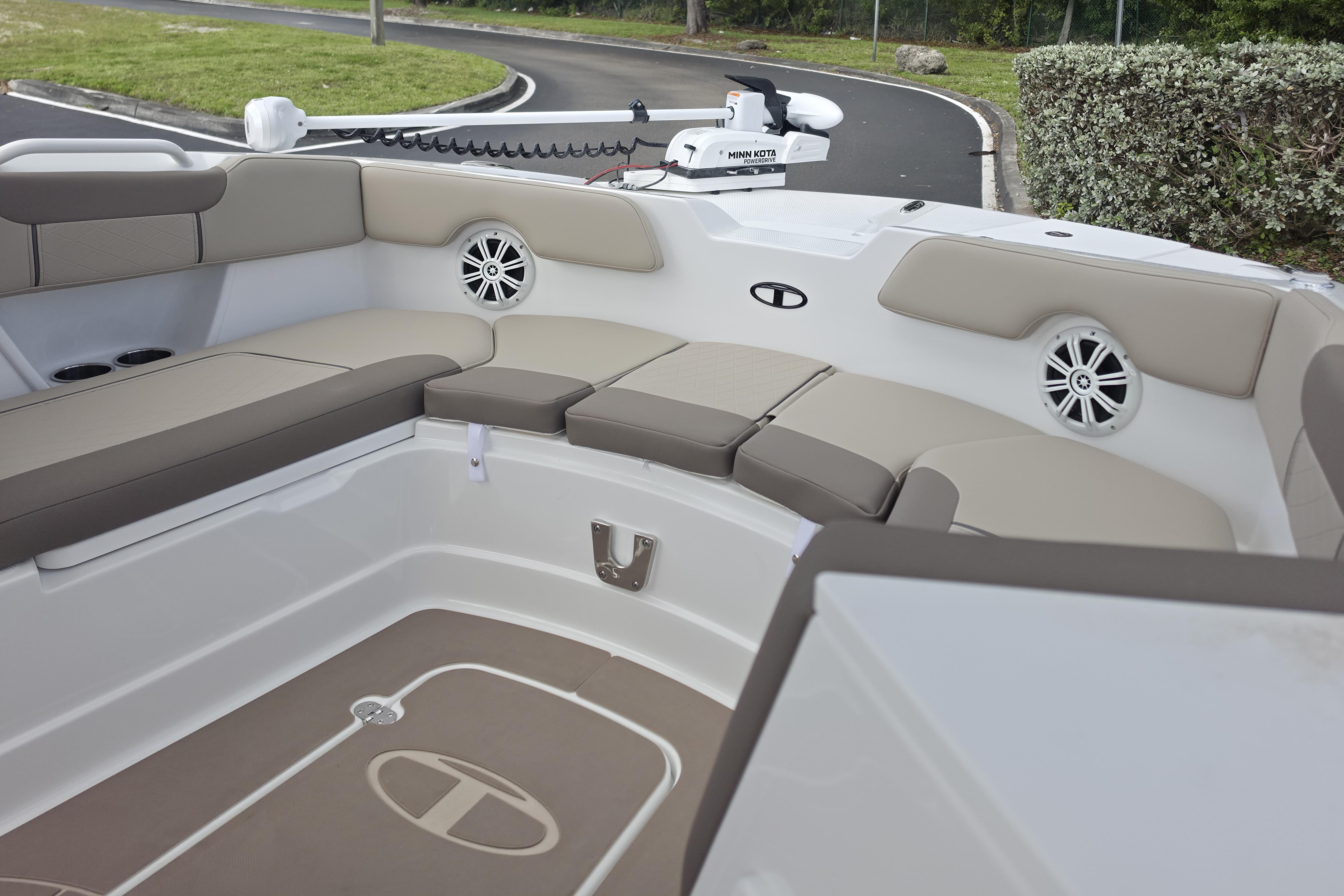2026 Tahoe 2150 CC boat interior with cushioned seating and speakers.