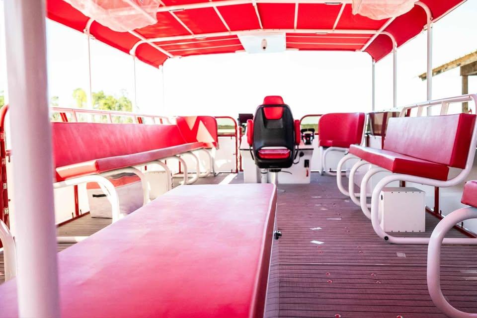2024 Aloha Pontoon 50' Water Taxi with red seating and canopy.
