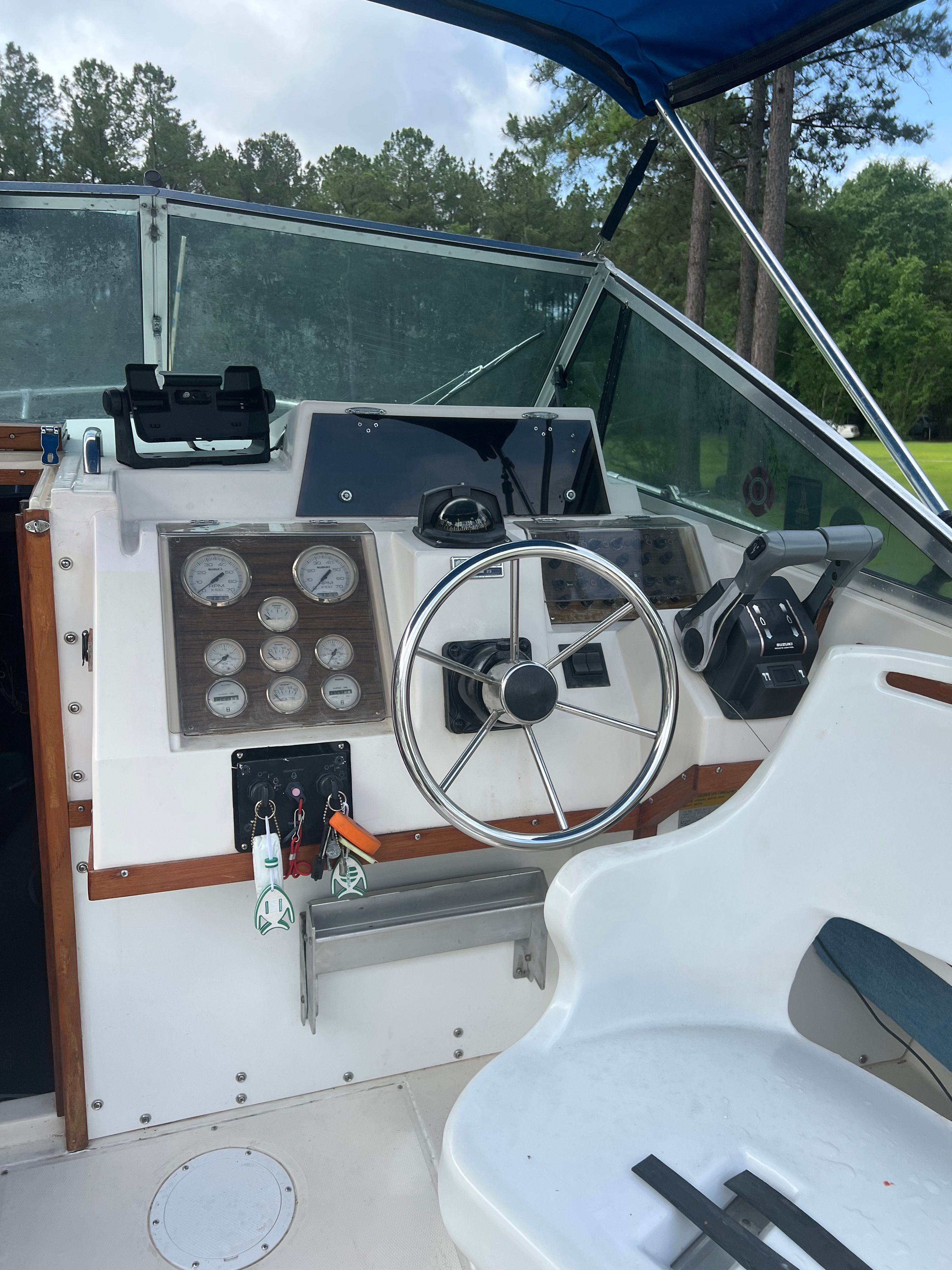 1987 Grady-White Gulfstream boat helm with steering wheel and gauges.