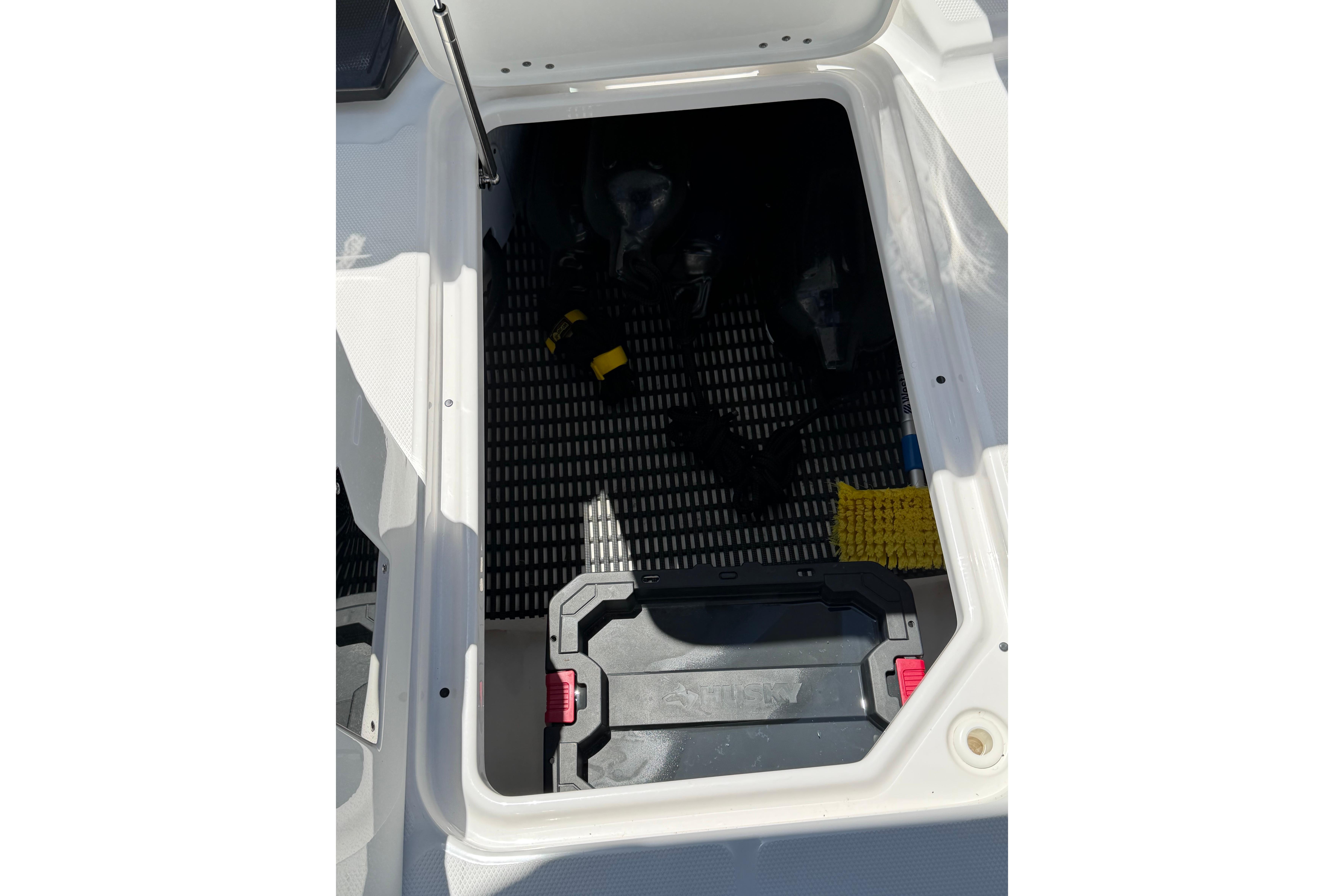 Open storage compartment in 2023 Monterey M-45 boat, featuring organized interior space.