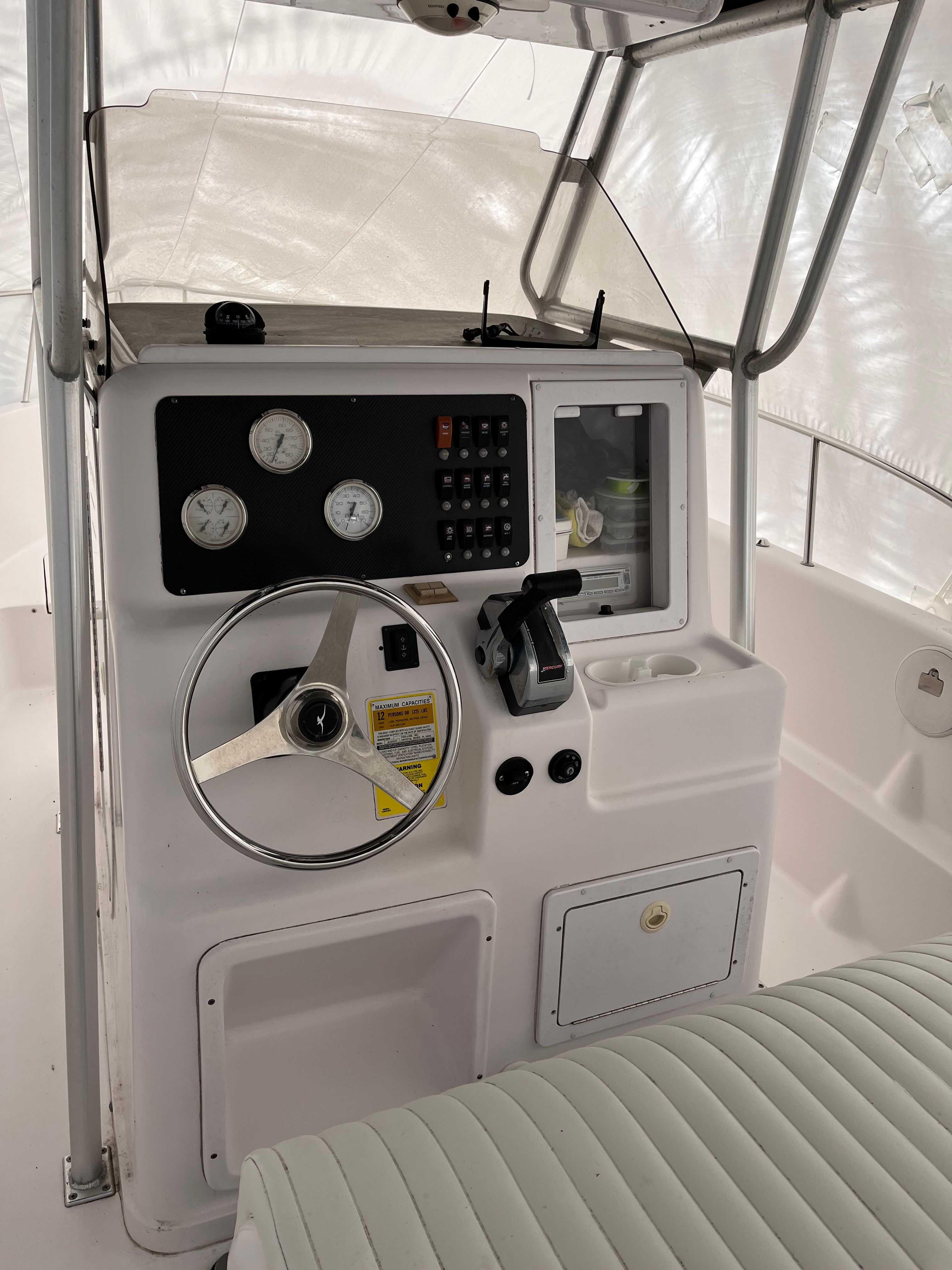 The image shows the helm of a 2002 Pro-Line Center Console boat.