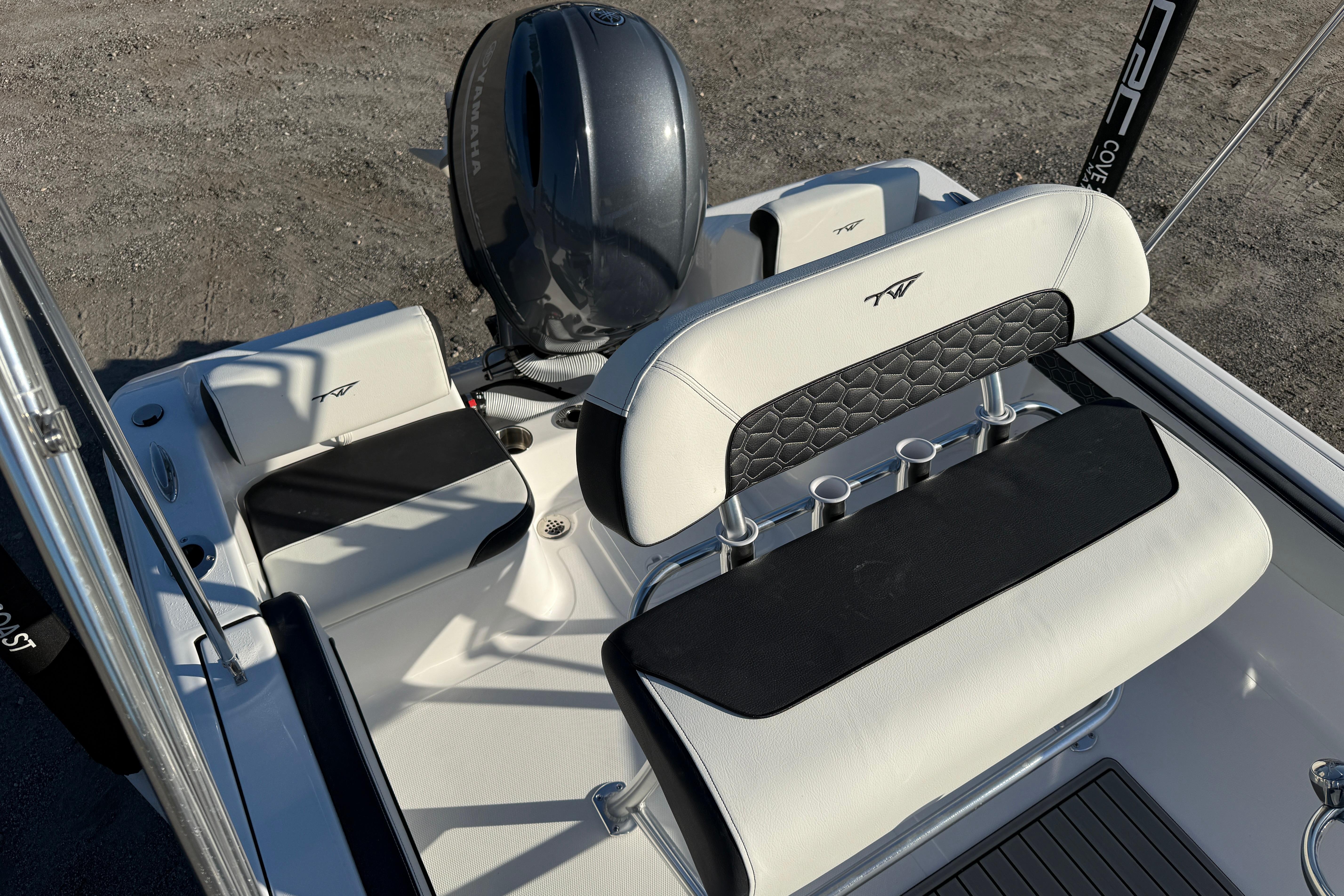 2026 Tidewater 180 CC Adventure boat interior with Yamaha engine, featuring sleek seating and rod holders.