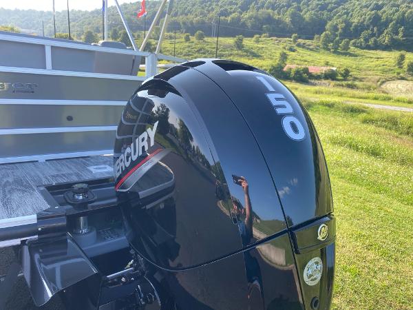 2024 Ranger Reata 223C with Mercury 150 outboard engine in scenic landscape.
