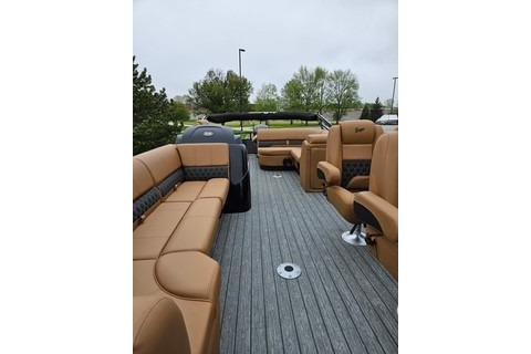 2026 Ranger 220FC boat interior with tan seating and gray flooring.