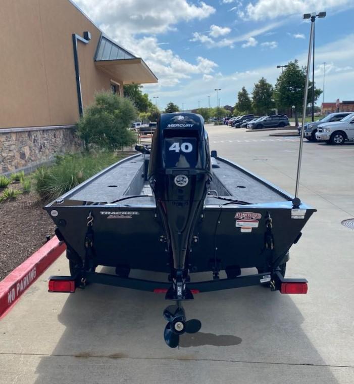2025 Tracker Panfish 17 boat with Mercury 40 engine in parking lot.
