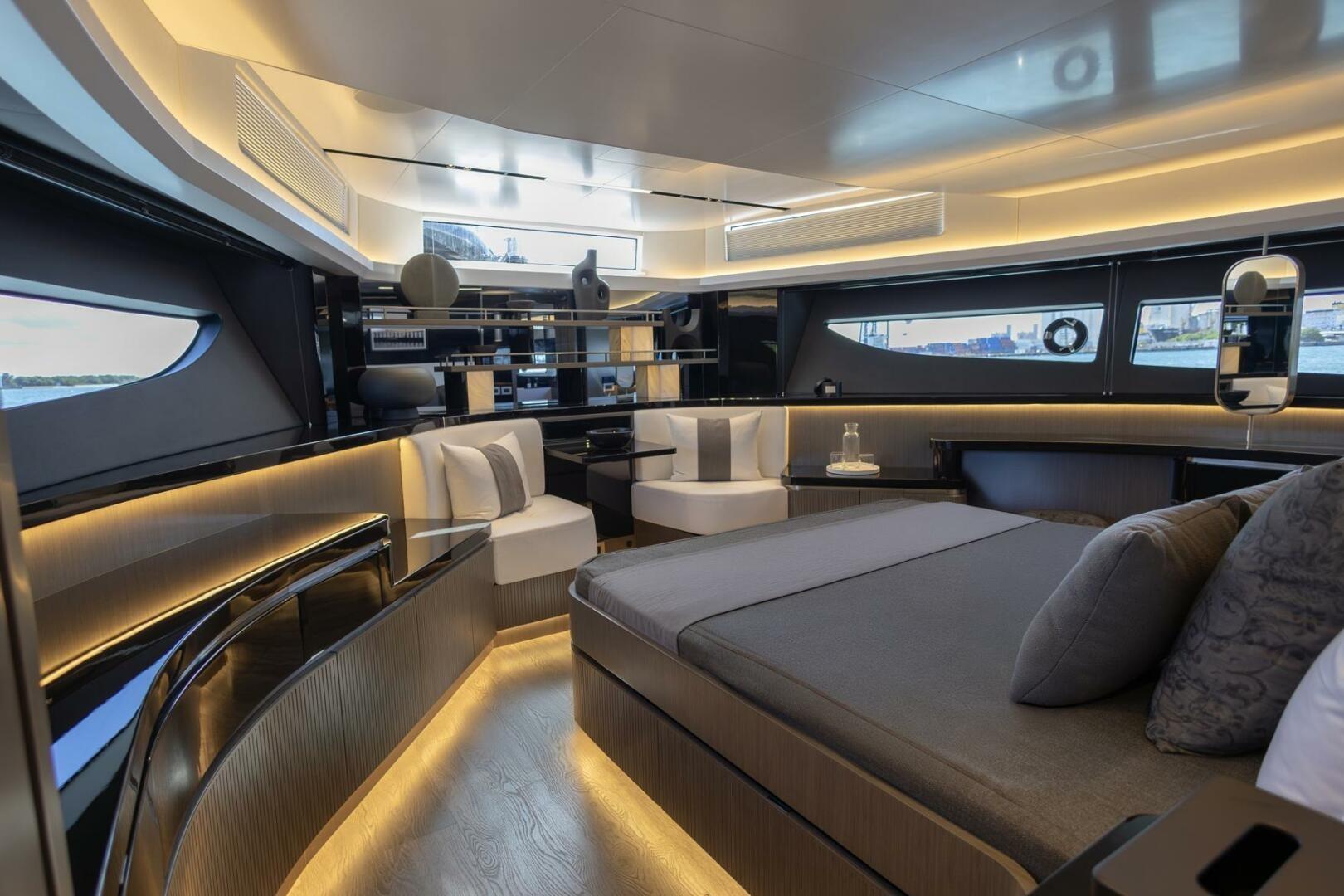 Luxurious interior of 2023 Pearl 72 yacht with modern furnishings and ambient lighting.
