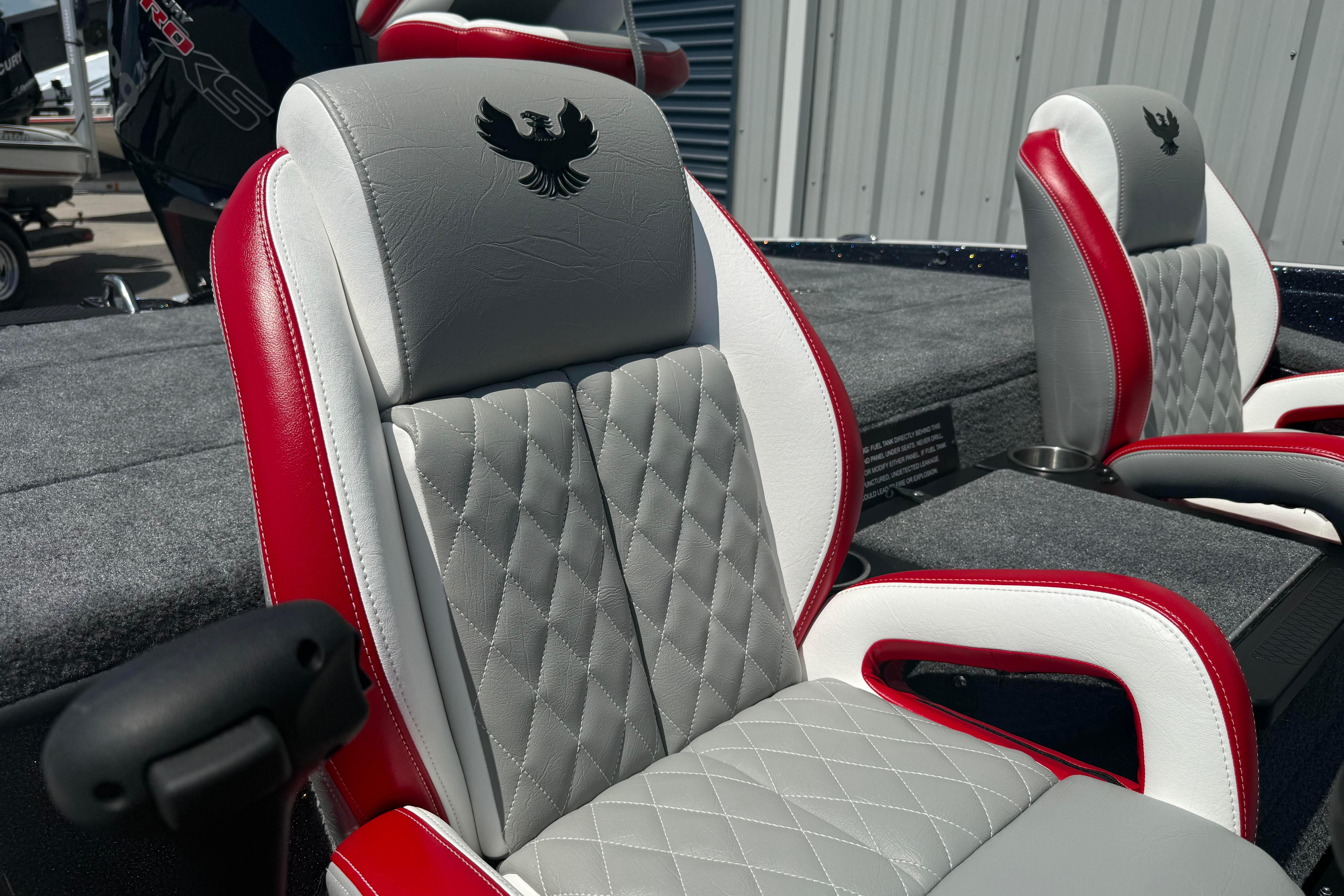 2027 Phoenix 819 ZXL boat seats with red and gray leather, featuring diamond stitching.
