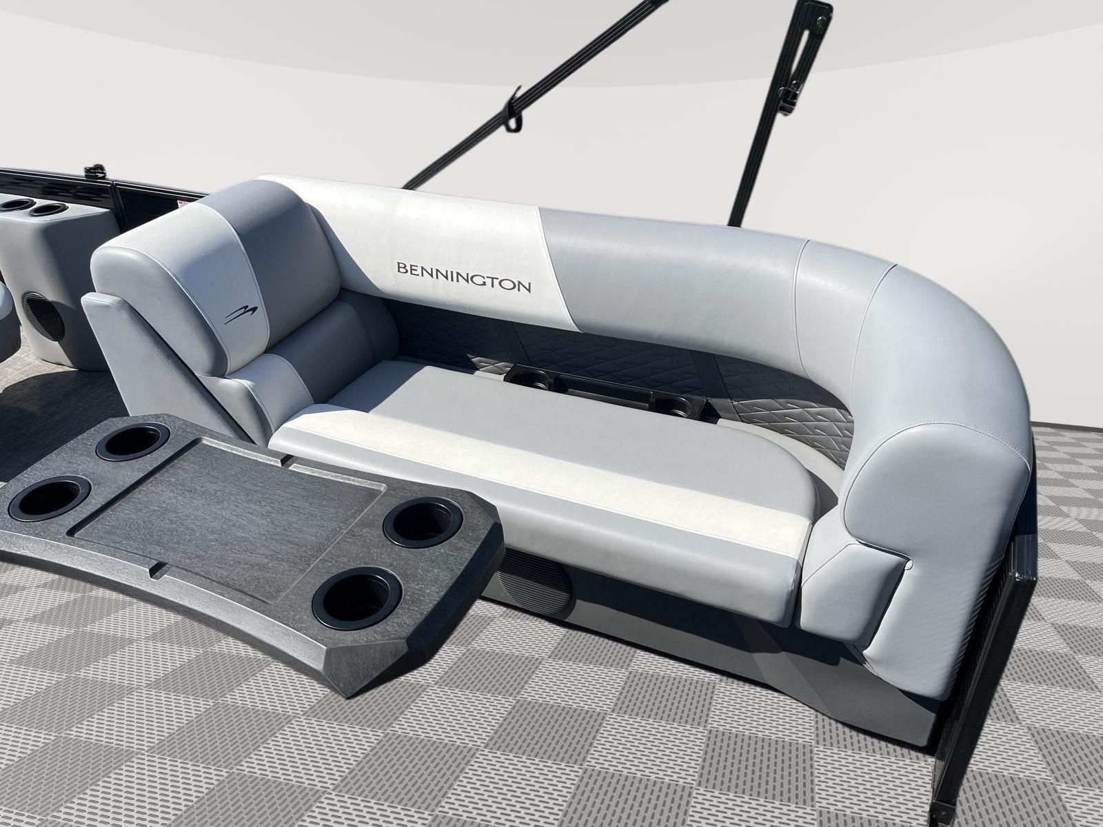 The image shows a luxurious bench seat on a 2025 Bennington S20 boat with gray upholstery.