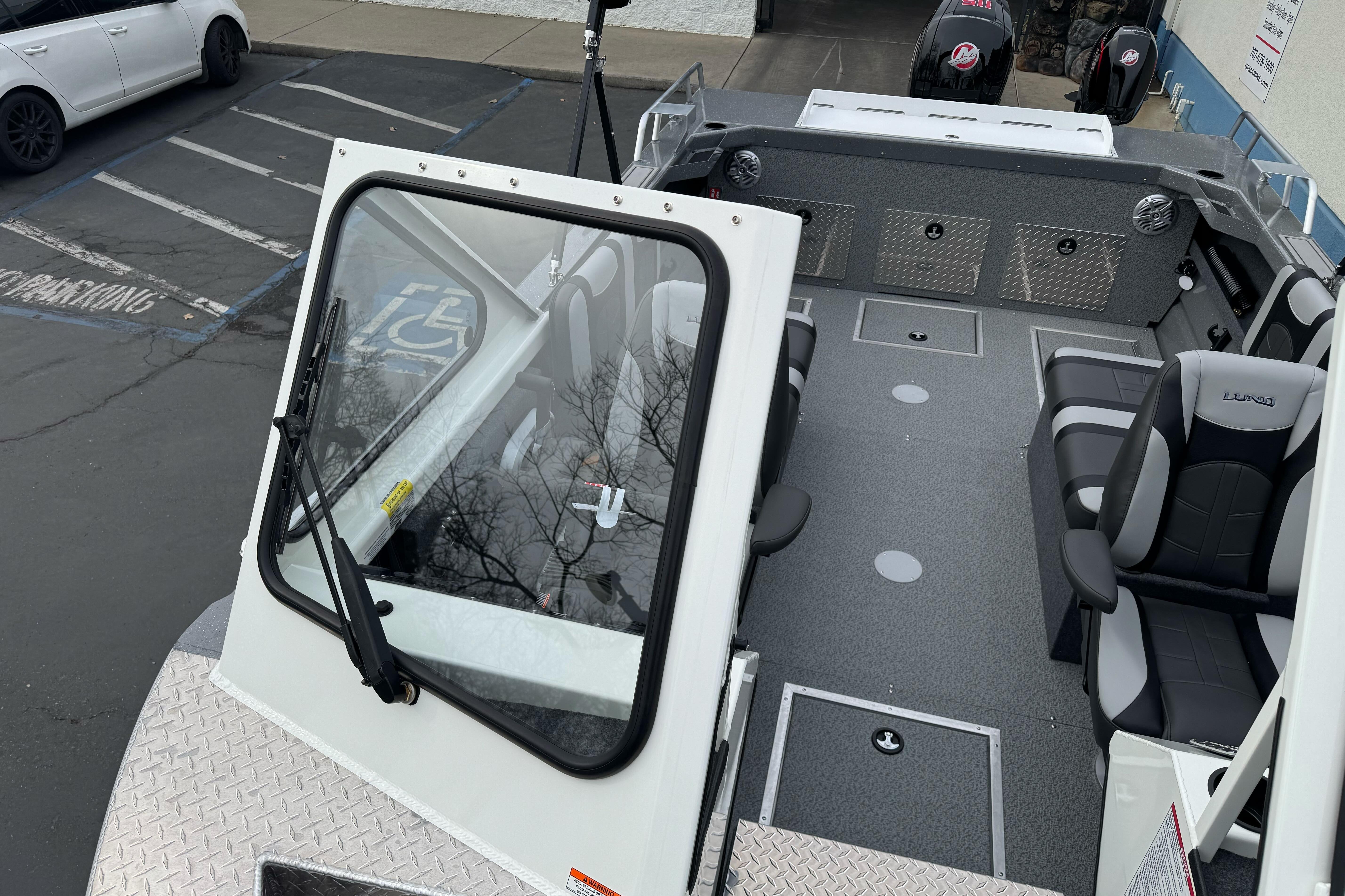 2026 Lund 185 Heavy Gauge boat interior with seating and storage compartments.