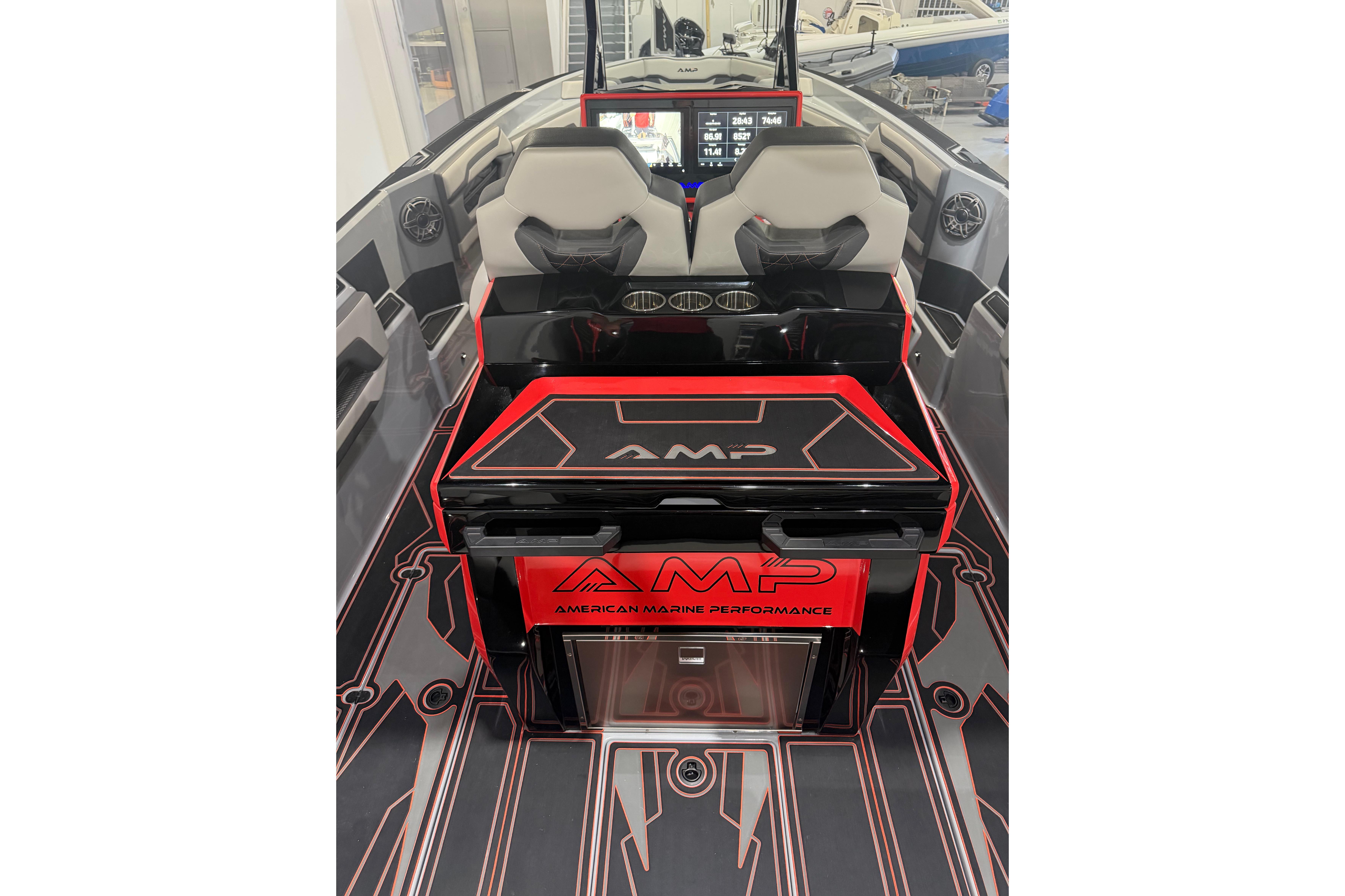 Interior of 2026 AMP 333 boat with modern design and advanced dashboard controls.