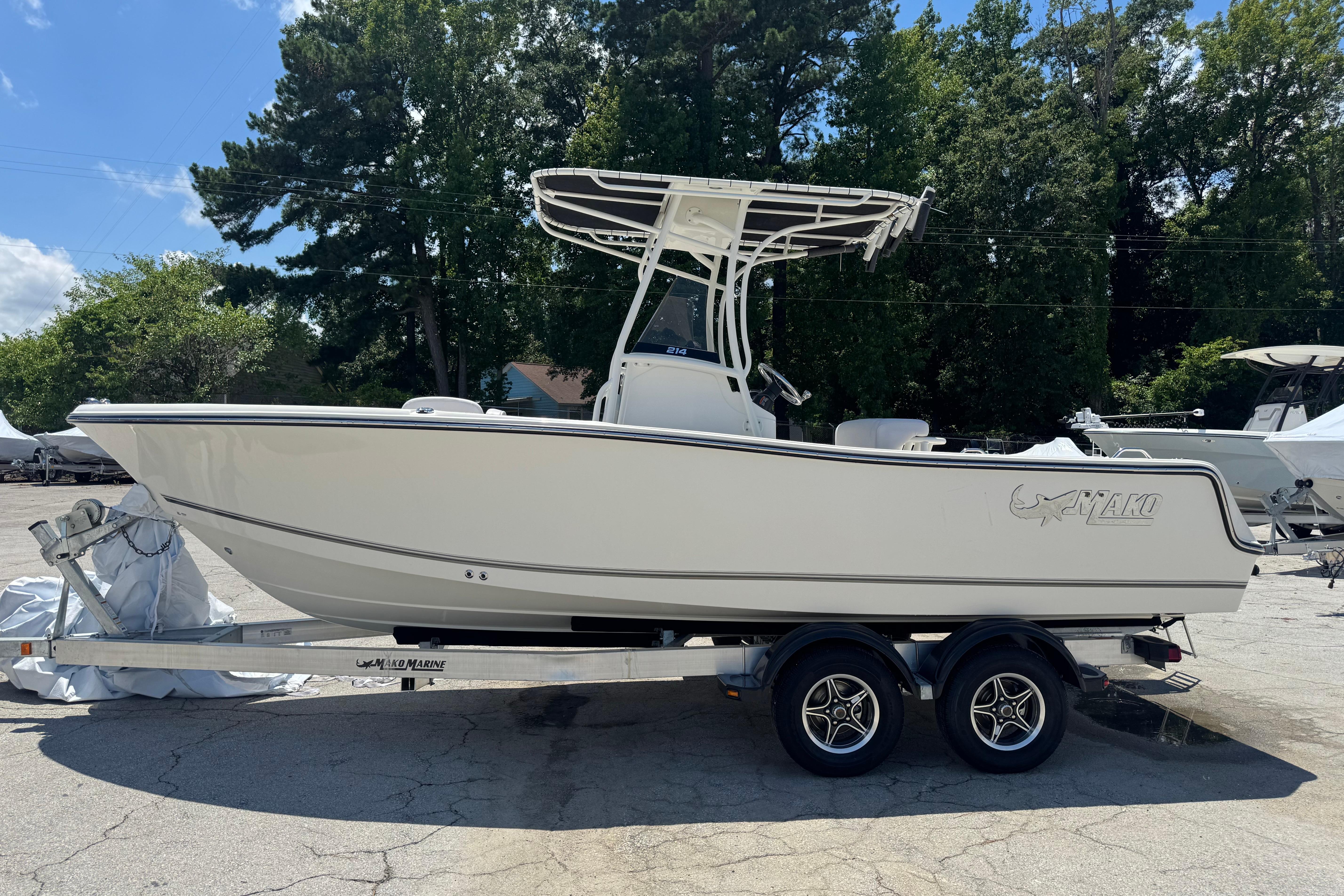 2026 Mako 214 Center Console boat on trailer, parked outdoors.