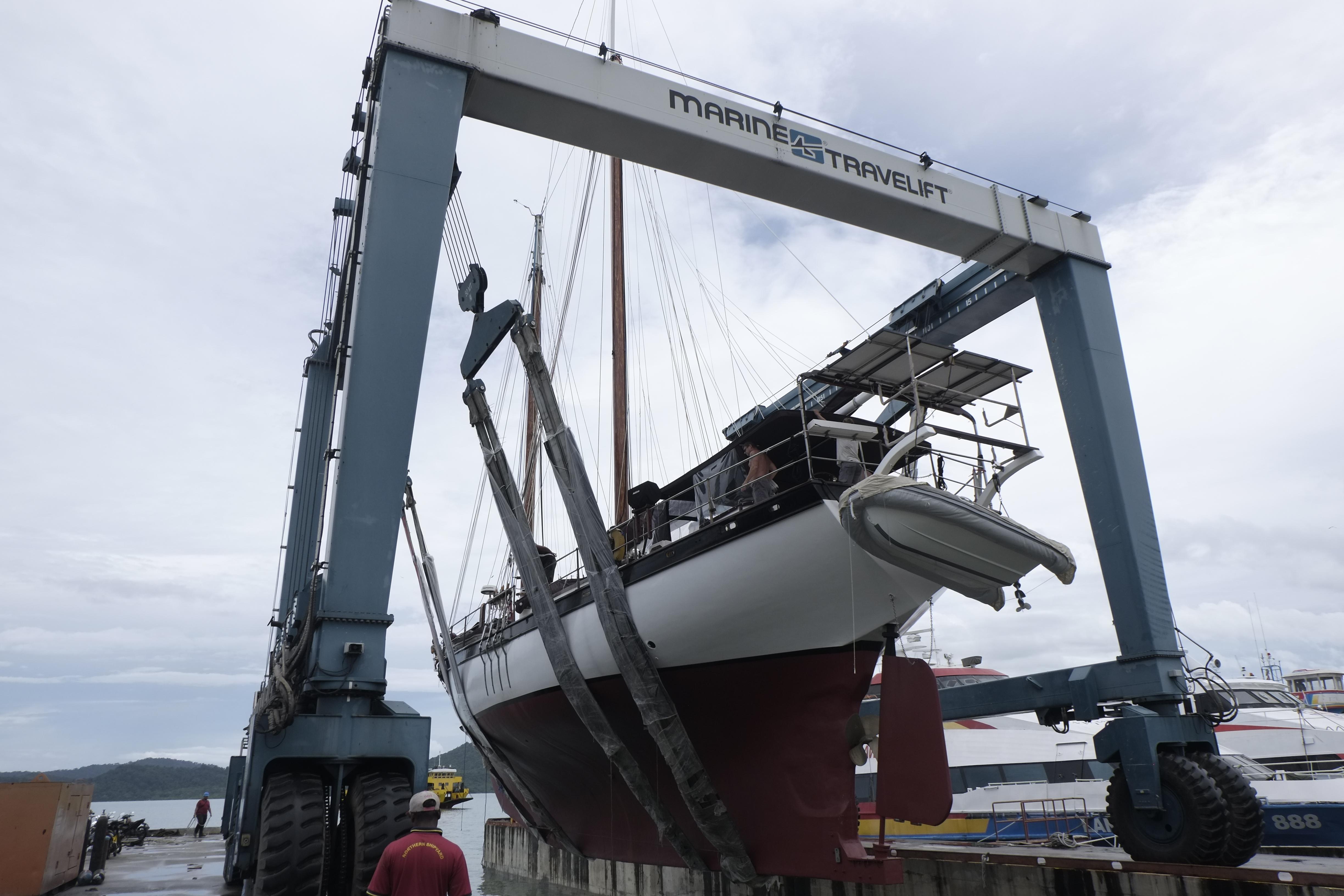 Custom Bud Macintosh schooner from 2006 being lifted by Marine Travelift.